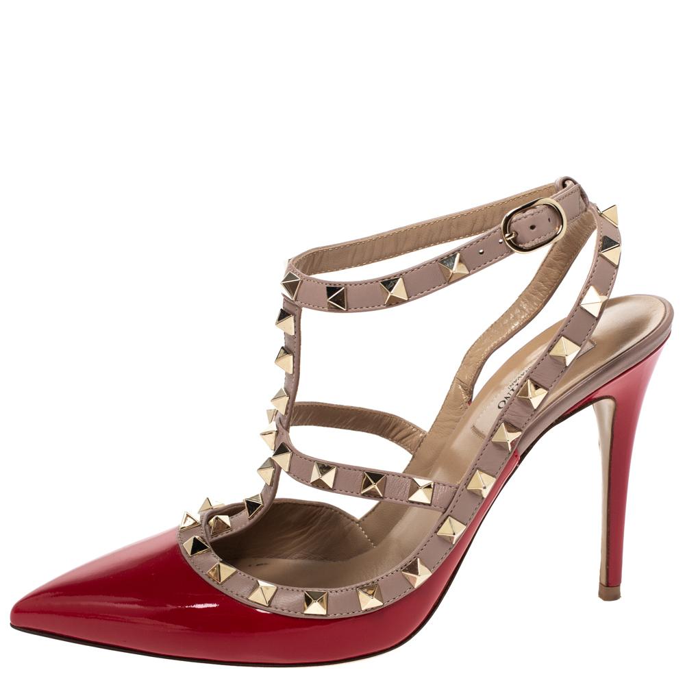 Instantly recognisable, the Rockstud sandals from Valentino are one of the most iconic styles from the brand. These sandals have been crafted from red & beige leather & patent leather and styled with the signature Rockstud accents on the straps.