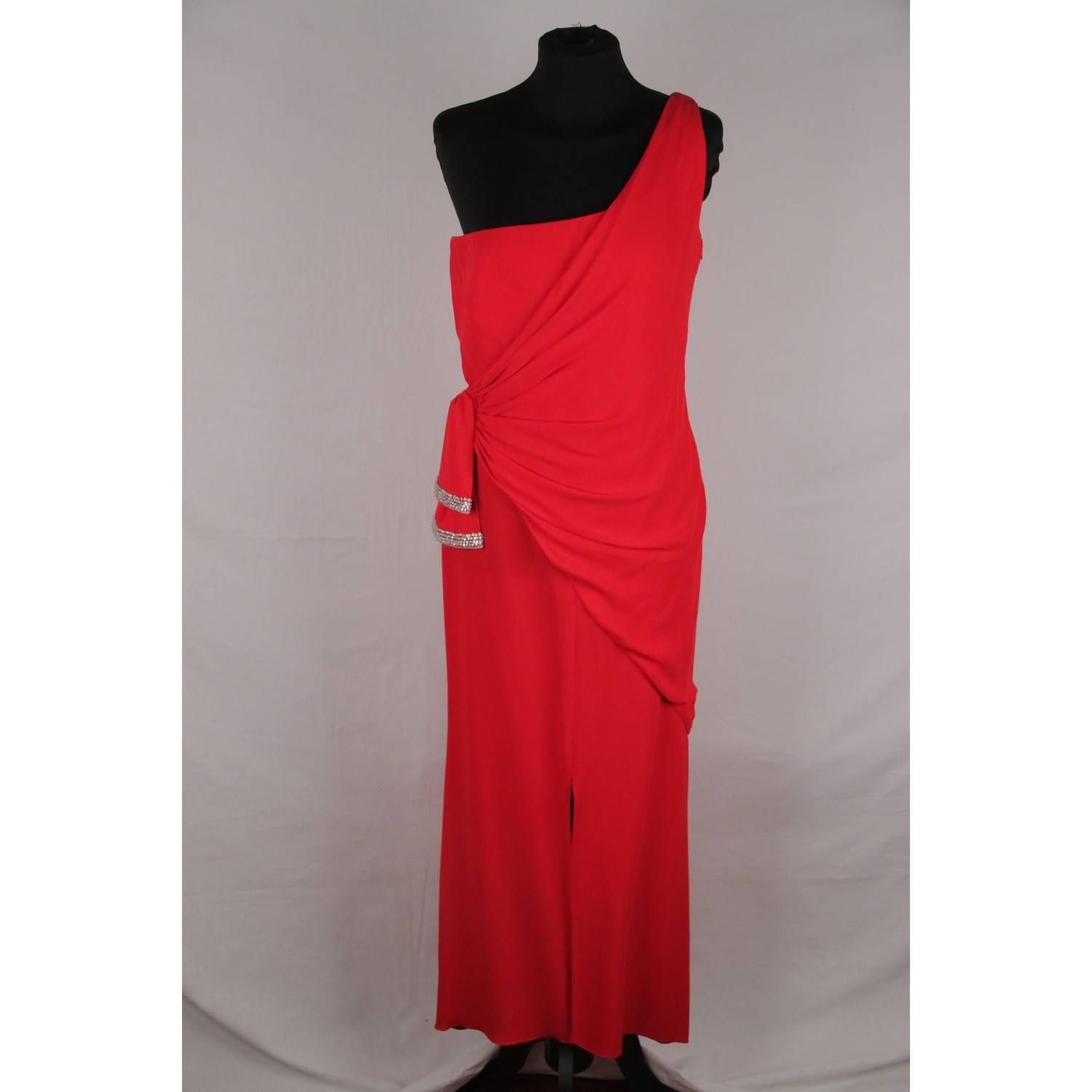 - Elegant VALENTINO one shoulder dress/gown in red  color
- Goddess Styling
-  Draping and knot detailing at the waist embellished with rhinestones 
- Side zip closure
- Front slit
- Size is not indicated. estimated size is a SMALL size