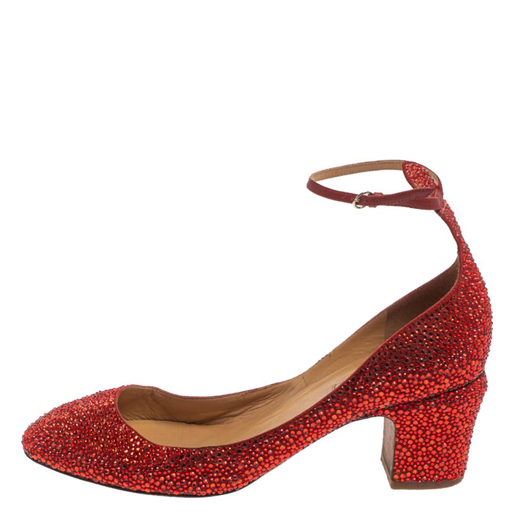 These gorgeous pumps from Valentino are all you need to make a statement! The red pumps are crafted from suede and embellished with crystals all over them. They come equipped with buckled ankle straps, comfortable leather-lined insoles and 6 cm