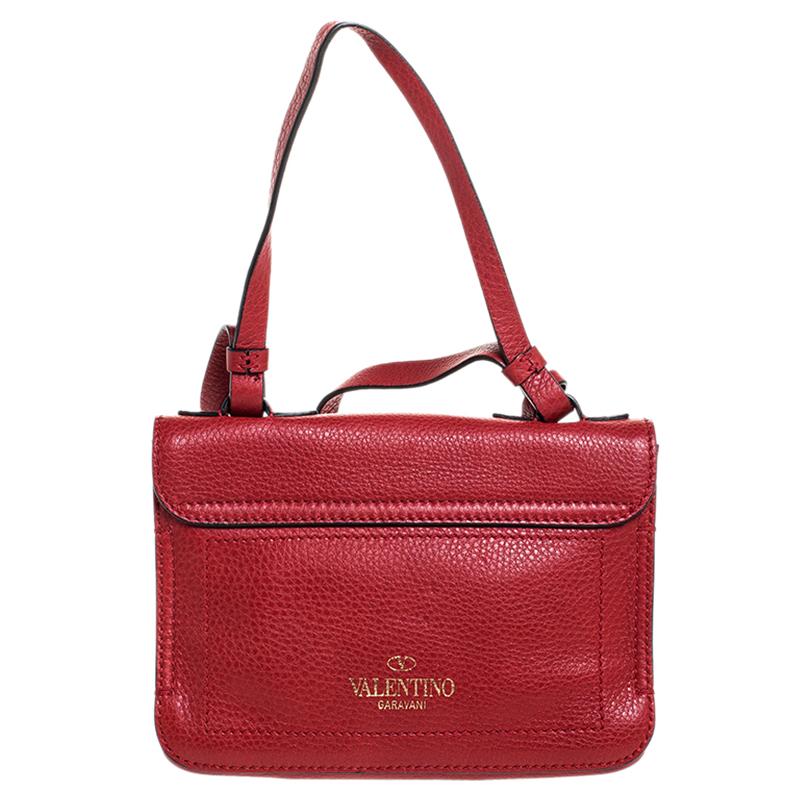 Made from red leather, this bag is both reliable and stylish. It comes in a flap style with features such as a shoulder strap, gold-tone hardware and a suede interior. This accessory from Valentino will do justice to both style and