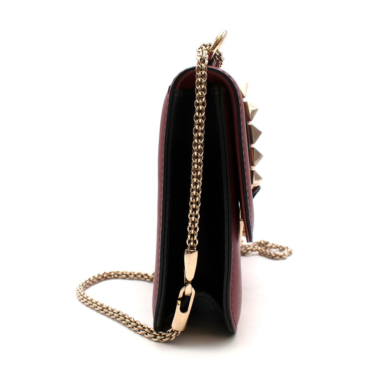 Valentino Red Leather Glam Lock Rockstud Shoulder Bag 

Valentino's signature Rockstud embellishments capture the essence of the Italian powerhouse: sophisticated and elegant with a tough-luxe edge. Crafted from leather, this black Valentino