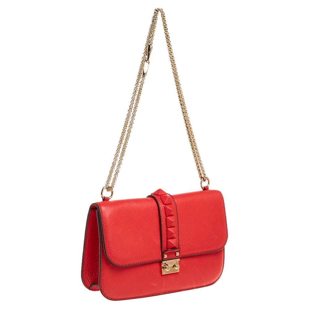 If you are looking for a bag with a blend of modern style and class, this Valentino creation is the answer. Crafted using leather, this fine creation comes with a gold-tone chain and a flap with a push-lock to secure the well-sized fabric interior.