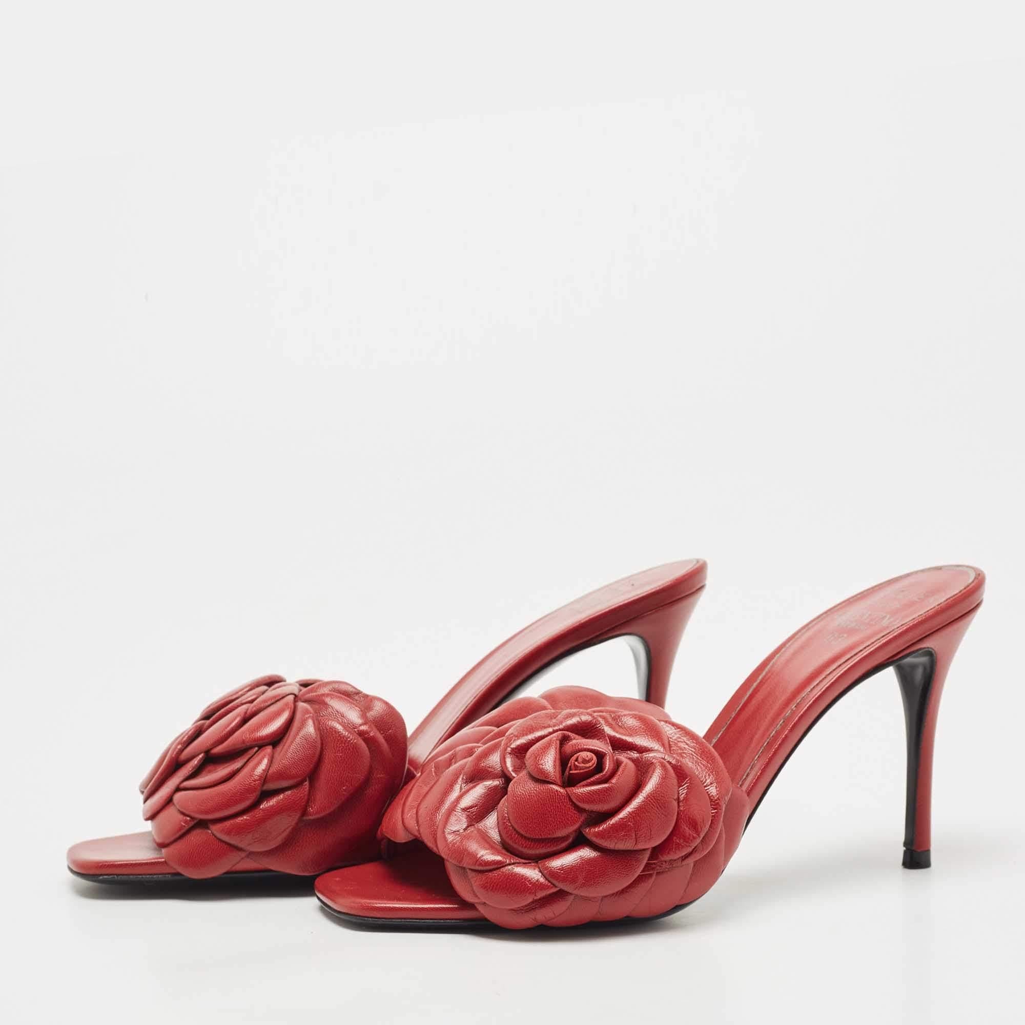 Infused with romantic aesthetics, these Valentino sandals are captivating in a red shade. They are made from leather and are appealing with rose atelier motif on the upper and are balanced upon 9cm heels.

Includes: Original Dustbag, Original Box,