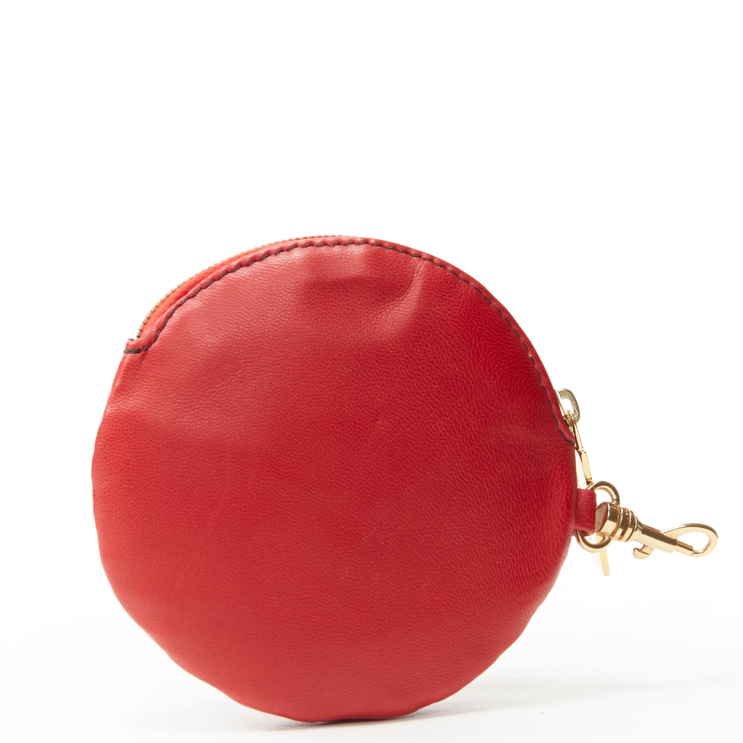 VALENTINO red leather Rose Petal gold zip coin purse bag charm 
Reference: MAWG/A00066
Brand: Valentino 
Material: Leather 
Color: Red 
Pattern: Solid 
Closure: Zip 
Extra Detail: Red leather. 3D rose petal. Gold-tone zip with Valentino logo.