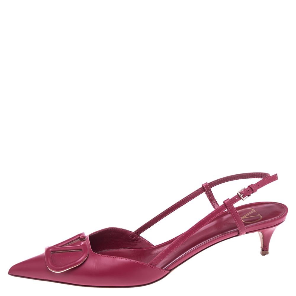 With the continued love for logomania, Valentino decided it's time for a more modern interpretation of heritage styles. Topped with a fresh VLogo plaque at the pointed toe, these leather pumps have dainty slingback straps and the kitten heel makes