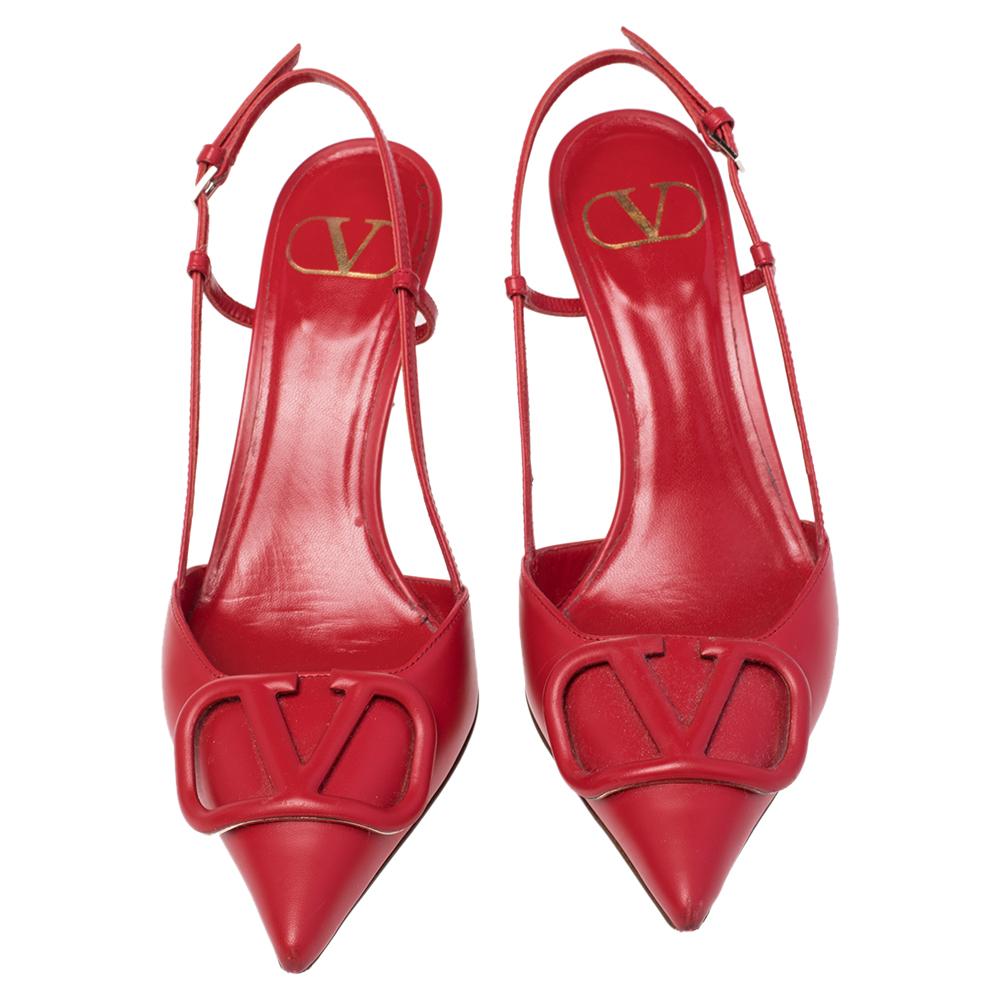 These stunning pumps showcase Valentino's feminine sensibilities and elegant aesthetics. Crafted in Italy from leather in a red shade, the pointed-toe silhouette is augmented by the VLogo Signature motifs on the uppers. Secured with slender