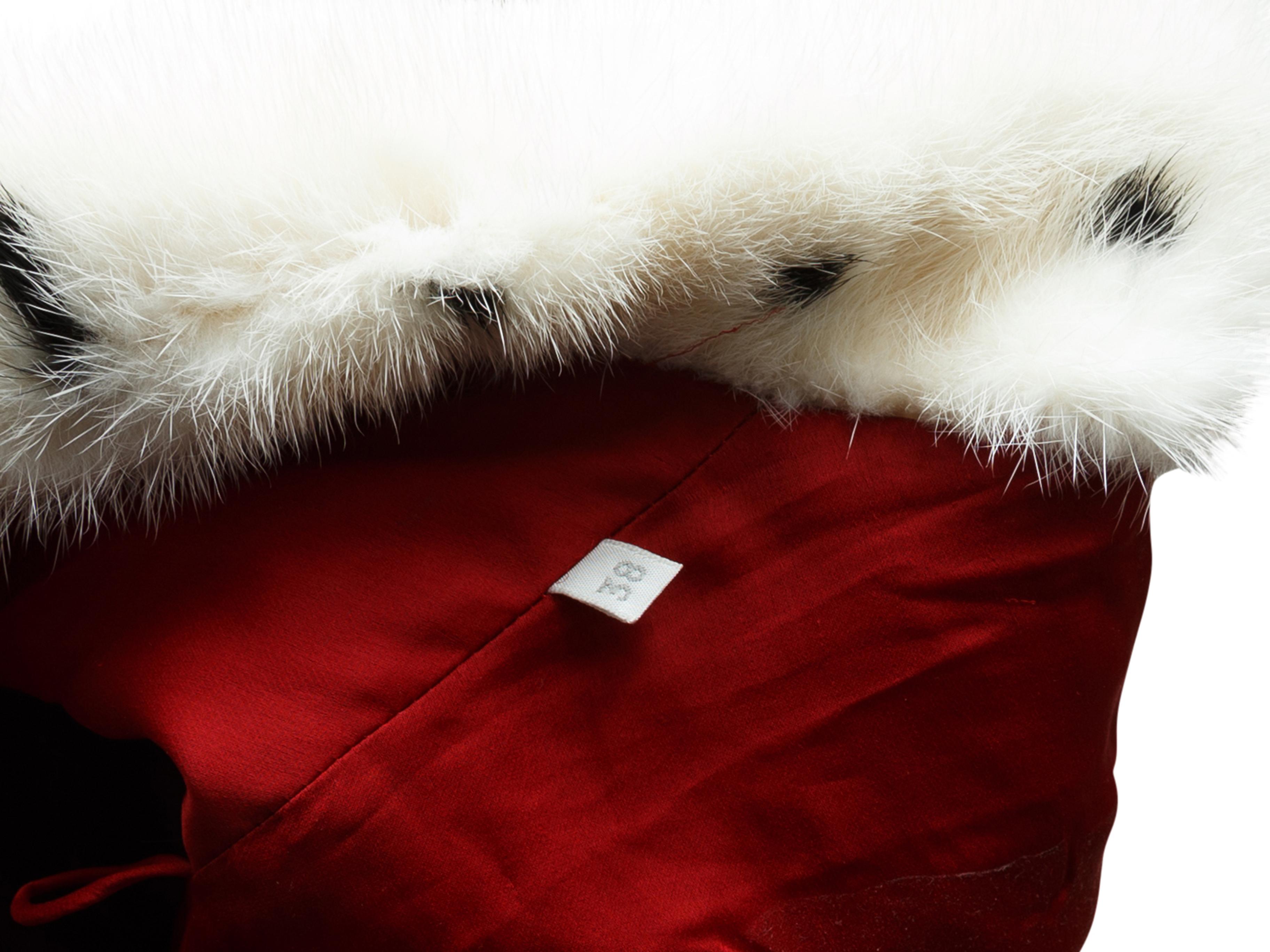 Product details: Red, black and white long mink fur coat by Valentino. Pointed collar. Closures at center front. 34