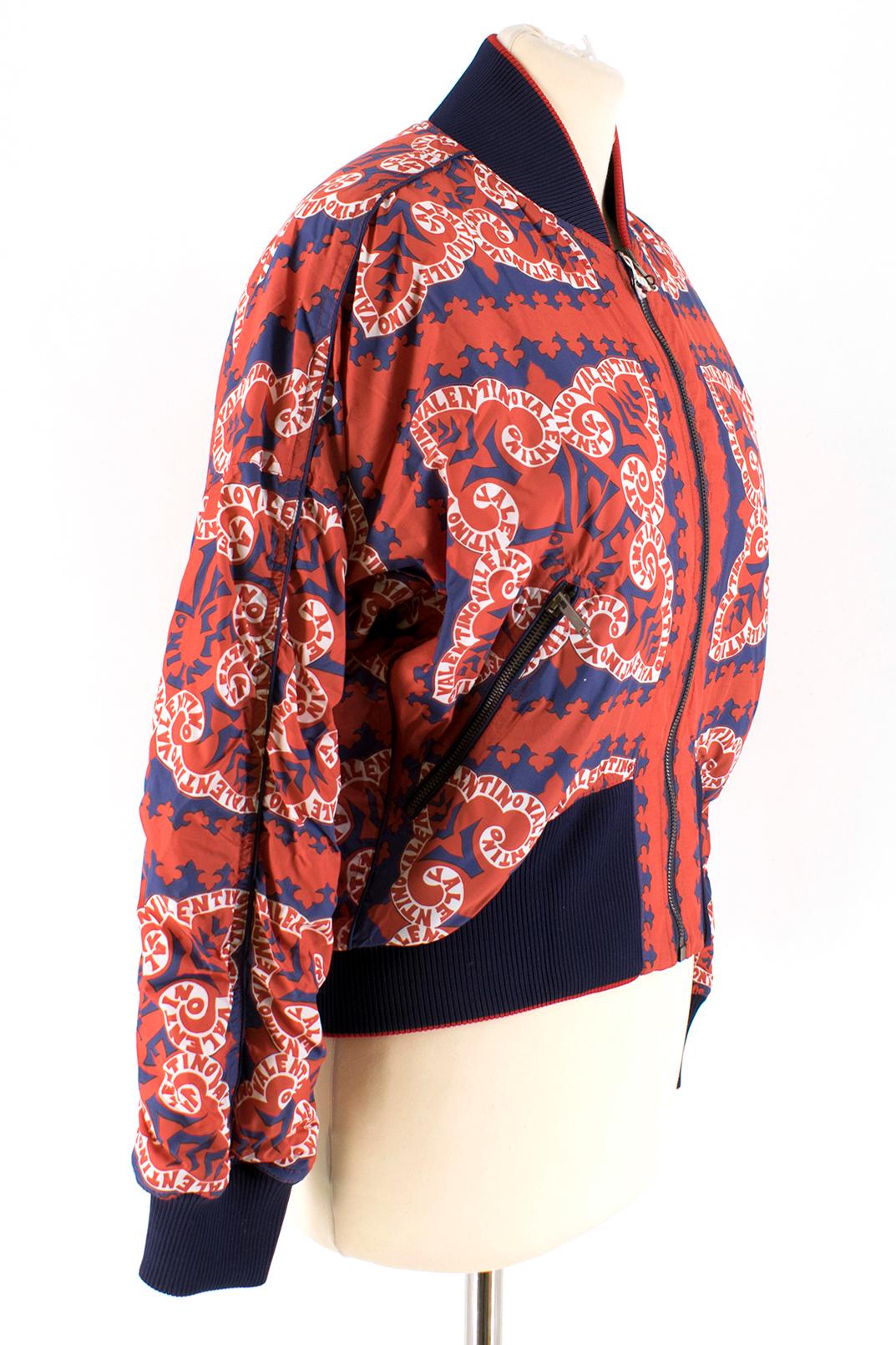Valentino red & navy logo print bomber jacket

- This luxurious Italian made bomber jacket is a sophisticated piece
- It features a spiraled logo print
- Stand up collar
- Stretchable blue cuffs
- Front zip fastening
- Front zip pockets and long
