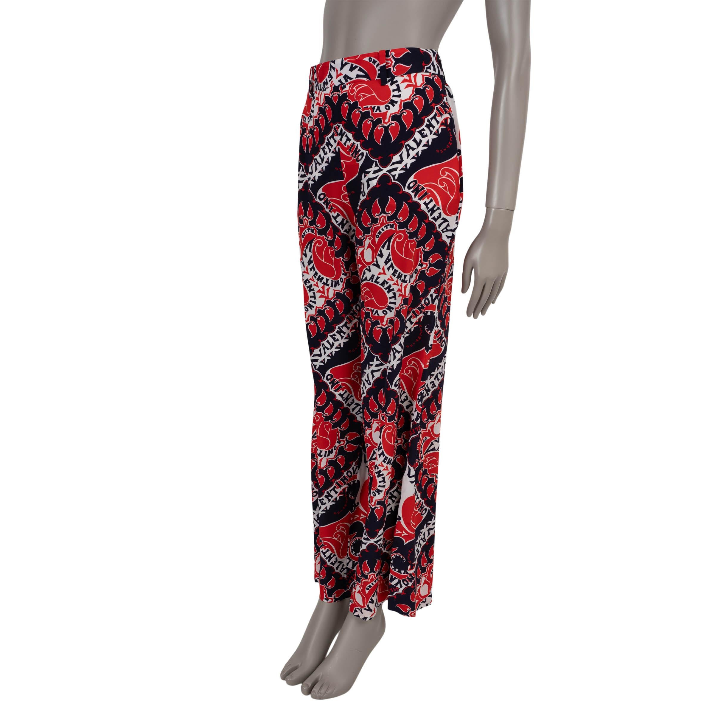 This 100% authentic Valentino pants in red, navy, and white Manifesto print crêpe de chine silk (100% - please note the size and content tag are missing) offer a lightweight, airy feel with effortless elegance. Designed with a high waist and