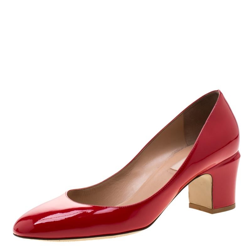 Amp up your style quotient by wearing this pair of patent leather pumps. This pair of Valentino pumps is a style statement and is a timeless piece. Have a fabulous day out while flaunting this pair of stunning red pumps.

Includes: The Luxury Closet