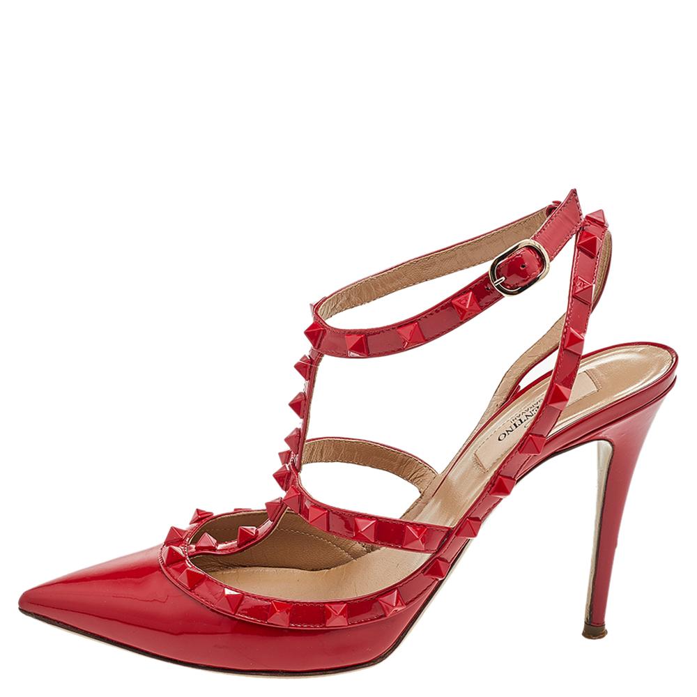 These Valentino sandals are designed using red patent leather, with the exterior displaying tonal stitch detailing and the iconic Rockstud embellishments. Simple buckle fastenings are added for a secured fit.
