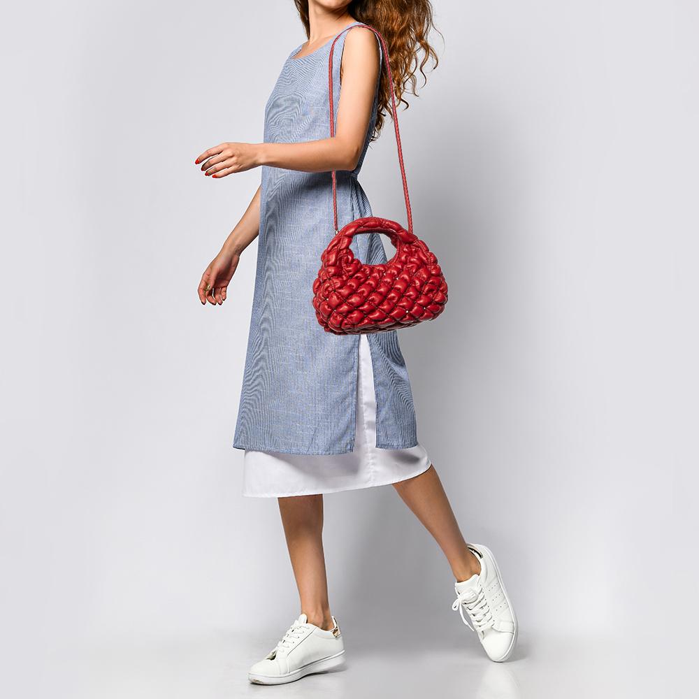 Valentino's Spikeme hobo has a slouchy structure covered in rhombus quilt pattern and studs. The bag is lined with leather and held by the single top handle or long shoulder strap.