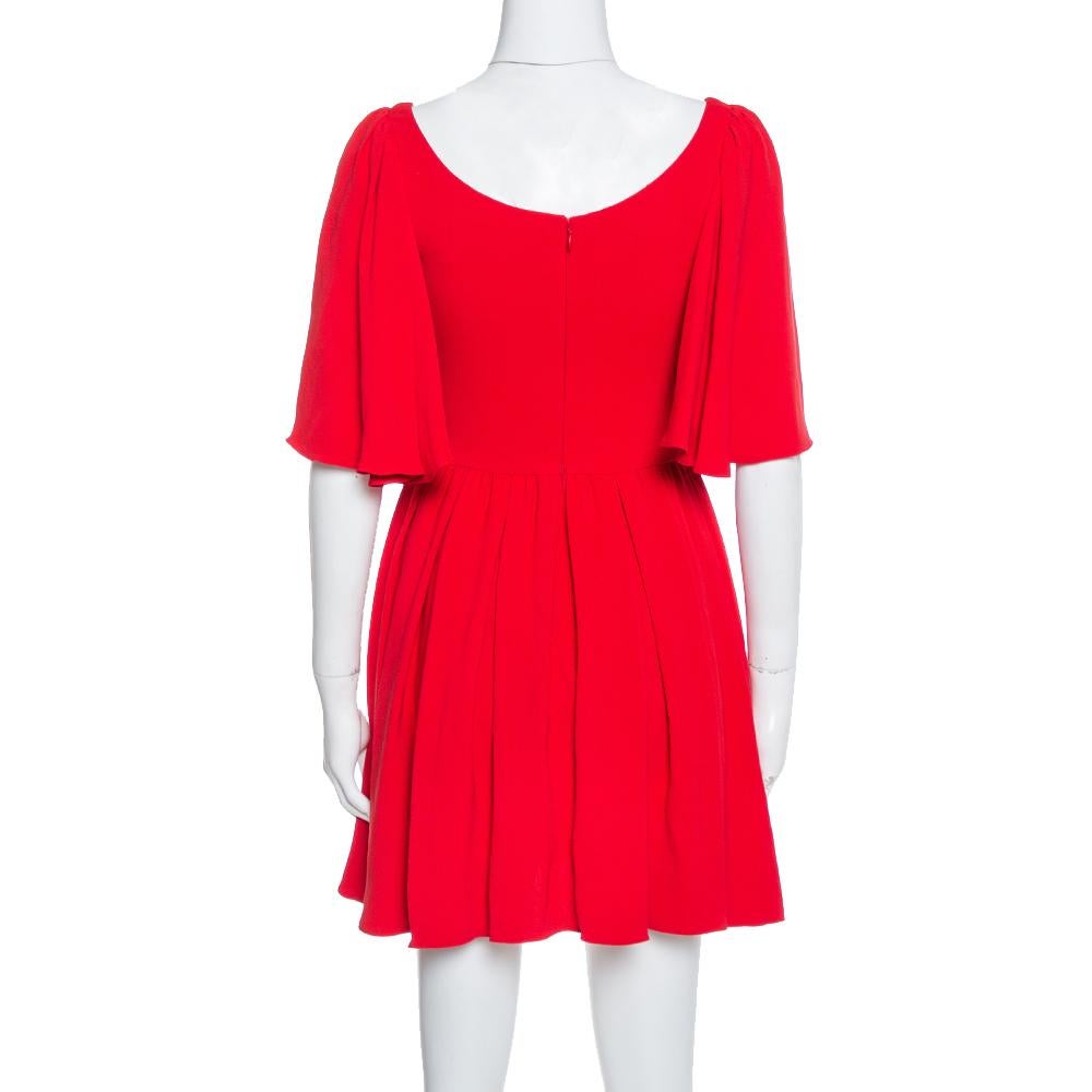 Gorgeous in shape and high on appeal, this dress is from the label of Valentino. It is tailored from quality fabrics in red and designed with a wide neckline and a fit and flare style. This creation will look perfect with statement sandals.

