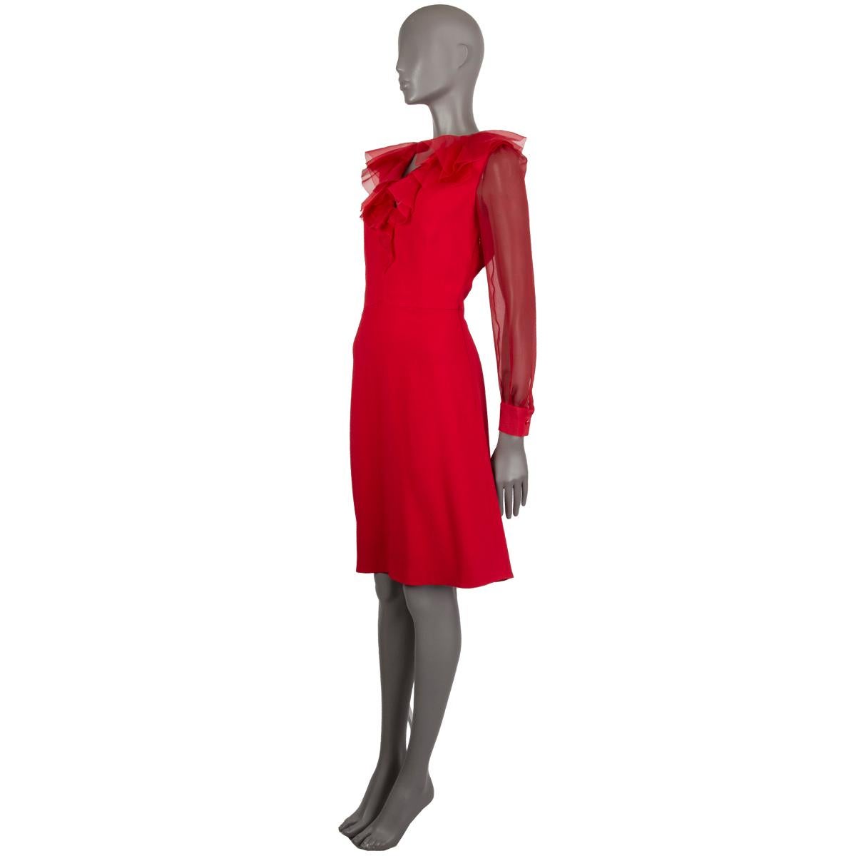 Valentino ruffle-collar dress in red viscose (95%) elastane (5%) with a layered silk ruffle- collar, sheer silk sleeves closes with a button, flared A-line skirt. Closes with a concealed zipper on the left side. Lined in red silk (100%). Has been