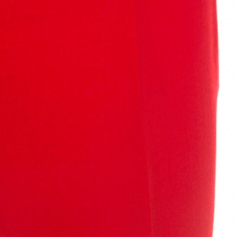 These stunning trousers by Valentino exude effortless style and sophistication. They are crafted from a wool blend and come in a striking shade of red. They are tailored to perfection, feature a zip closure and have a good fit. Pair them a solid top