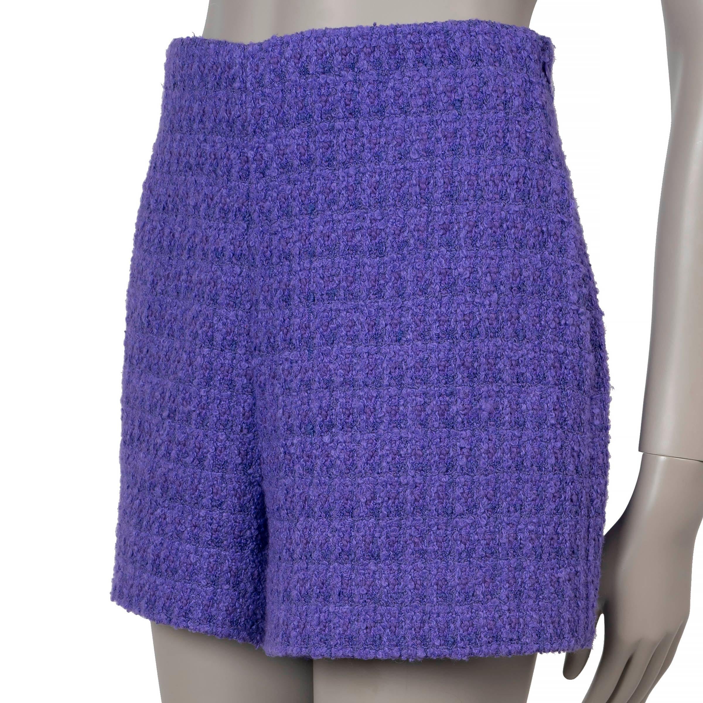 These 100% authentic Valentino mini Bermuda shorts are crafted from a luxurious blend of Rich Violet purple bouclé cotton (31%), acrylic (30%), viscose (18%), wool (15%), and polyester (6%). They feature a high waist and two side slit pockets for a