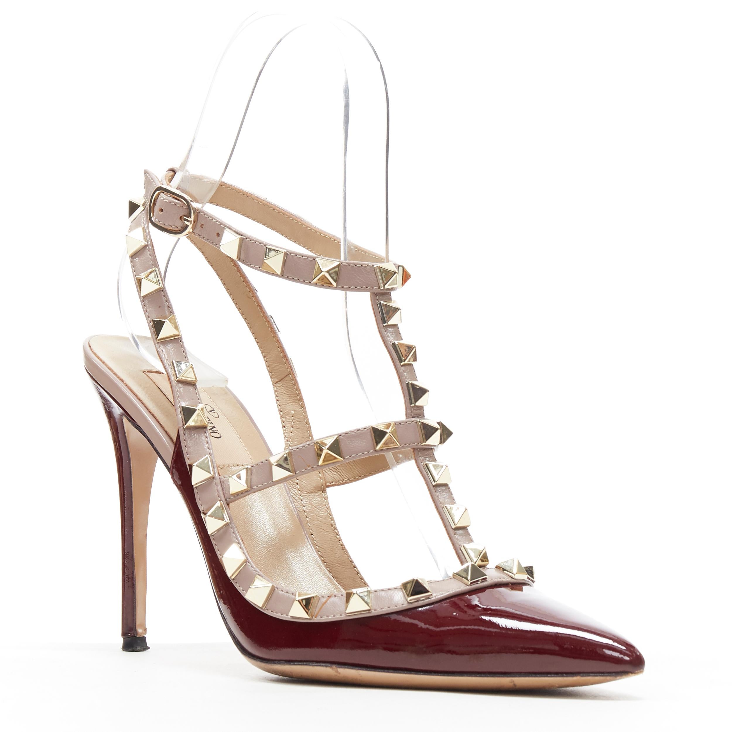 VALENTINO Rockstud burgundy red patent gold studded caged point toe heel EU39
Brand: Valentino
Model Name / Style: Rockstud pump
Material: Patent leather
Color: Burgundy
Pattern: Solid
Closure: Ankle strap
Extra Detail: High (3-3.9 in) heel height.