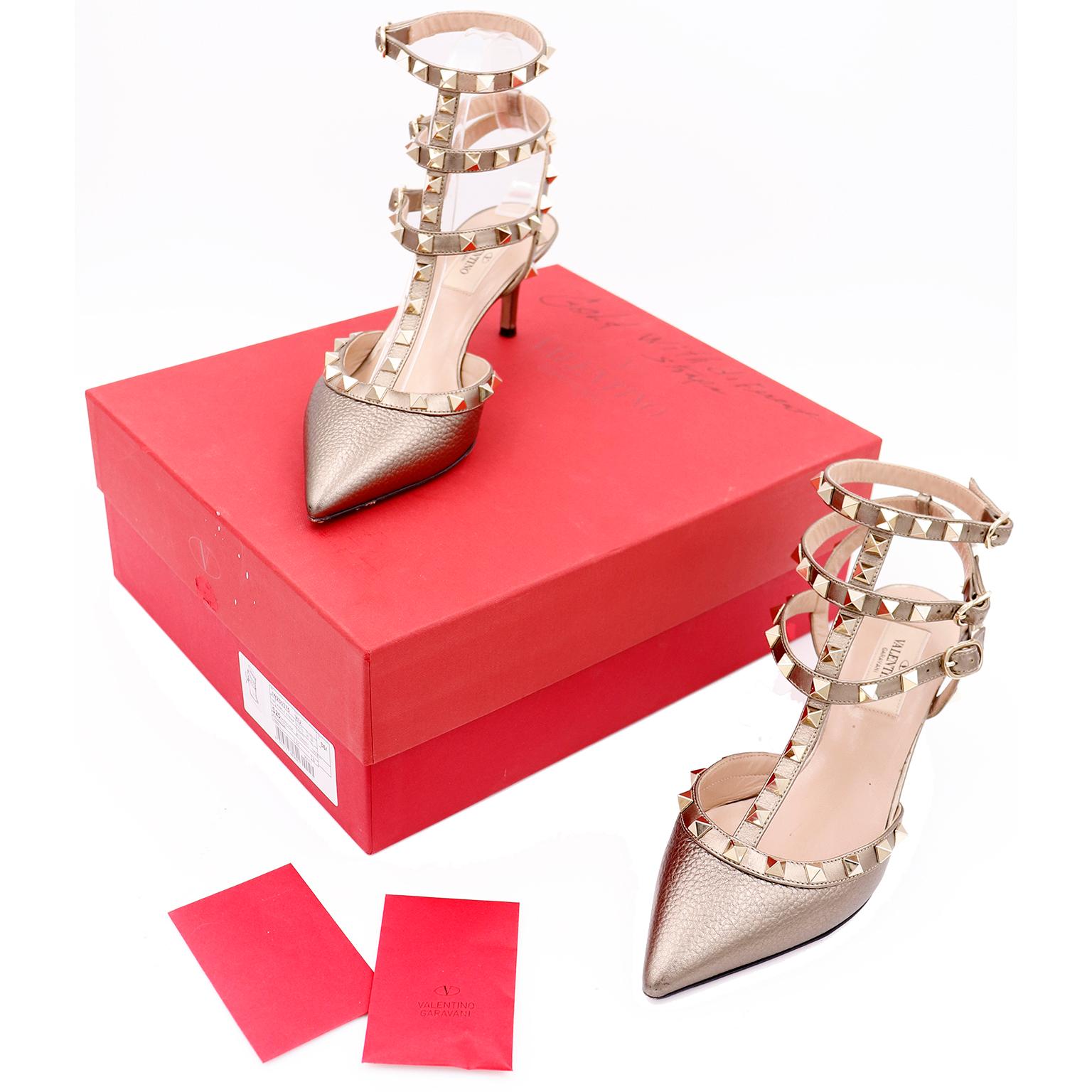 These Valentino Rockstud Heels are in a bronze pebble grain leather with gold studs. There are adjustable ankle straps with gold hardware and the shoes come with
their original box with two replacement rockstuds and the original care instruction