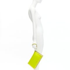 VALENTINO Rockstud neon yellow studded leather flap wristlet clutch bag
