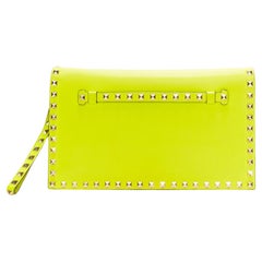 VALENTINO Rockstud neon yellow studded leather flap wristlet clutch bag