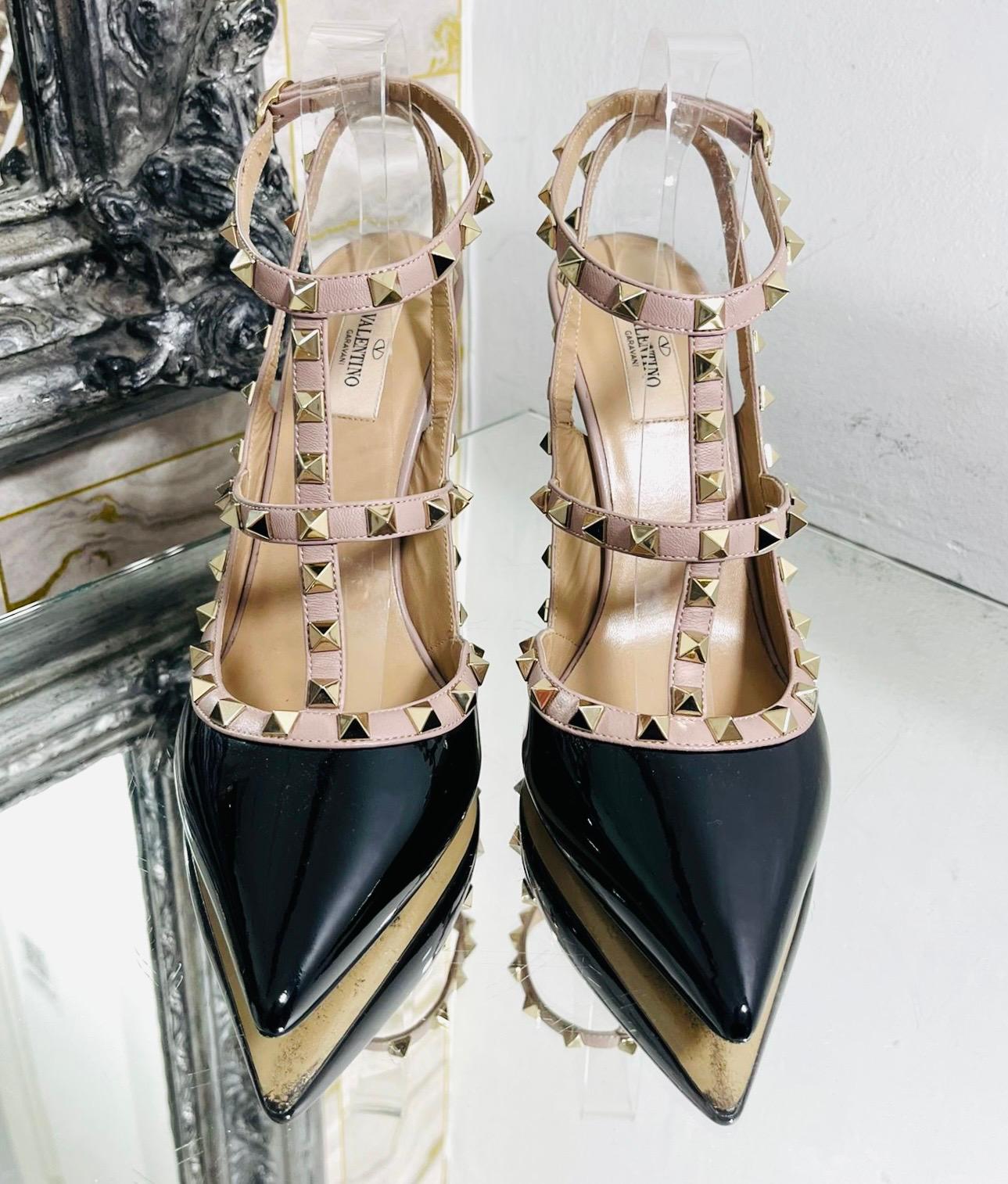 Valentino Rockstud Patent Leather Heels

Black, slingback heels designed with nude straps detailed with the brand's signature gold Rockstuds.

Featuring pointed toe, stiletto heel and adjustable buckle closure. Rrp £820

Size – 41.5

Condition –