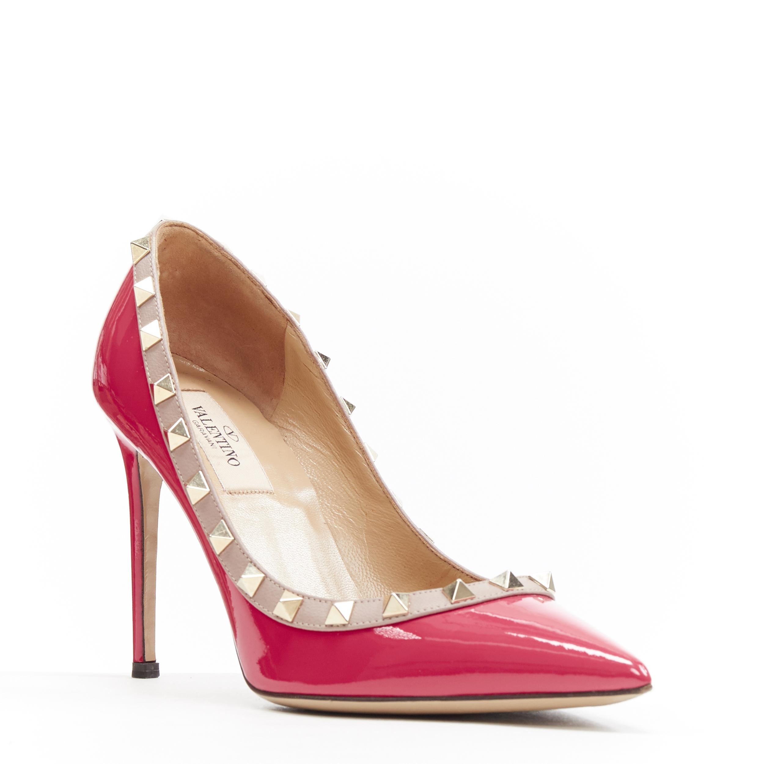 VALENTINO Rockstud pink patent pyramid stud trimmed pointy pigalle pump EU35.5
Brand: Valentino
Model Name / Style: Rockstud pump
Material: Patent leather
Color: Pink
Pattern: Solid
Extra Detail: High (3-3.9 in) heel height. Pointed Toe. Slim