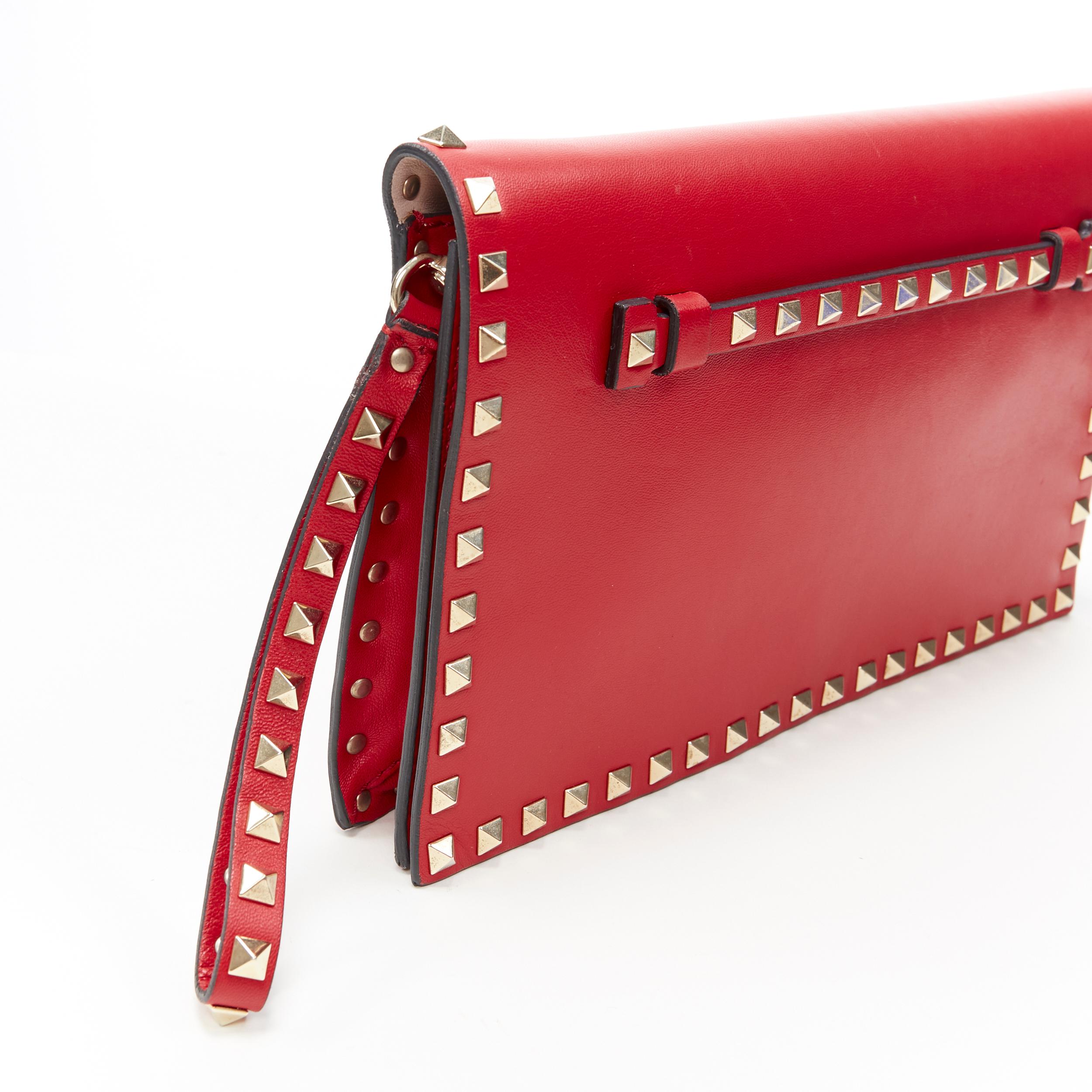 Red VALENTINO Rockstud red leather gold studded bordered wristlet flap clutch bag