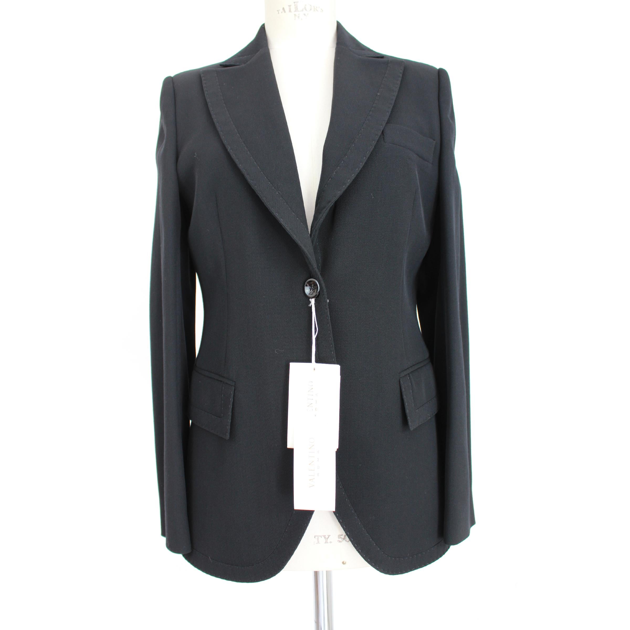 Valentino Roma vintage women's pants suit. Jacket and classic trousers, black, 100% virgin wool, palazzo pants, lined jacket. 90s. Made in Italy. New with tag.

Size: 46 It 12 Us 14 Uk 

Shoulder: 46 cm 
Bust / Chest: 51 cm 
Sleeve: 63 cm 
Length:
