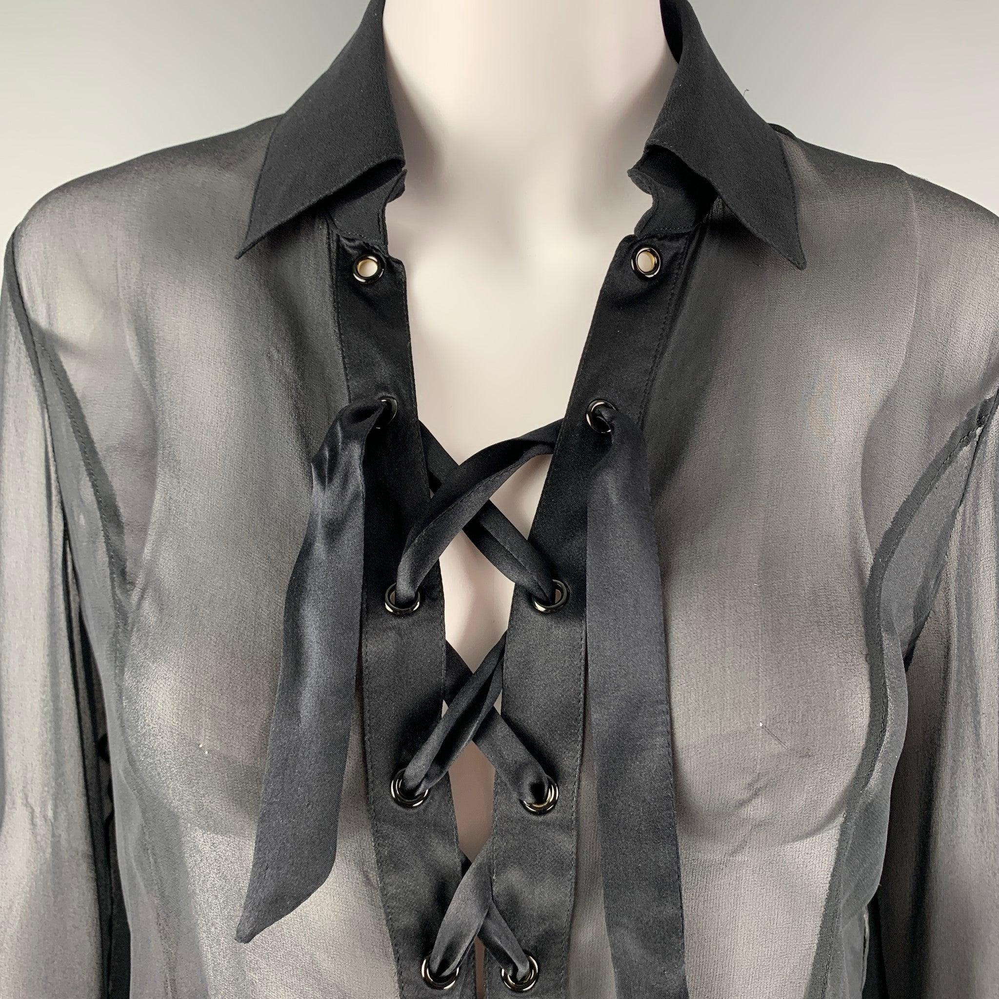 VALENTINO Roma long sleeves shirt comes in black silk woven material featuring a see through style, straight collar, laced front detail, and rivets detail at sleeve. Made in Italy.Excellent Pre-Owned Condition. Minor signs of wear. Missing Button