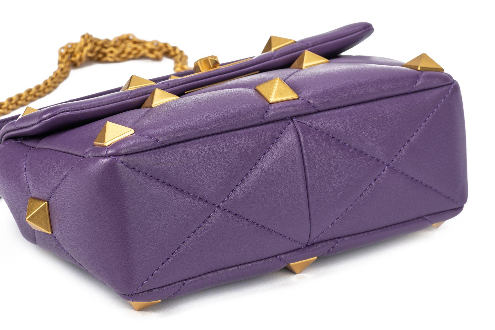 Valentino Roman Stud Collection in lavender lambskin leather. Diamond-quilted shoulder bag with tonal studs and a versatile top handle and cross body strap combination. Handle drop 3”, detachable shoulder strap 24”  The bag is new and comes with the