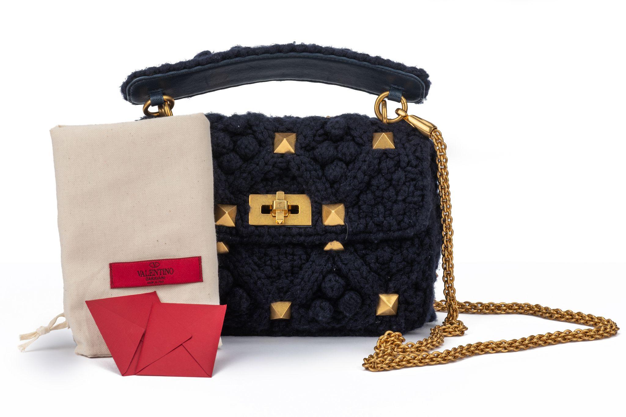 Valentino Roman Stud Collection in navy blue cashmere. Diamond-quilted shoulder bag with gold tone studs and a versatile top handle and cross body strap (25.6') combination. The bag is new and comes with the original dustcover.