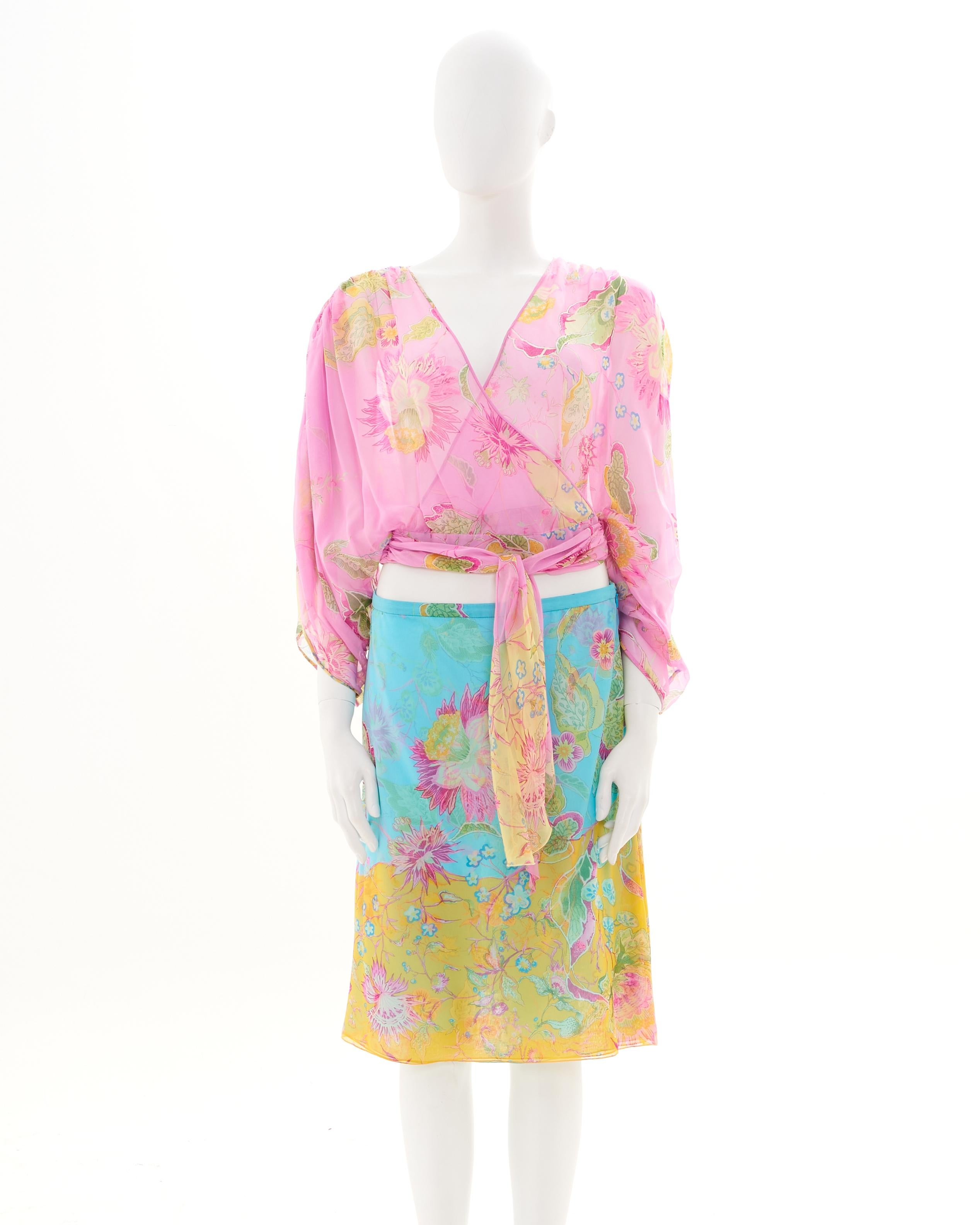 - Designed by Valentino Garavani
- Sold by Skof.Archive
- Spring-Summer 2004
- Pink floral wrap silk shirt with v-neckline
- Turquoise and yellow floral silk skirt with side slit
- Low-rise 
- Left hidden zipper closure 
- Mini Turquoise butterfly