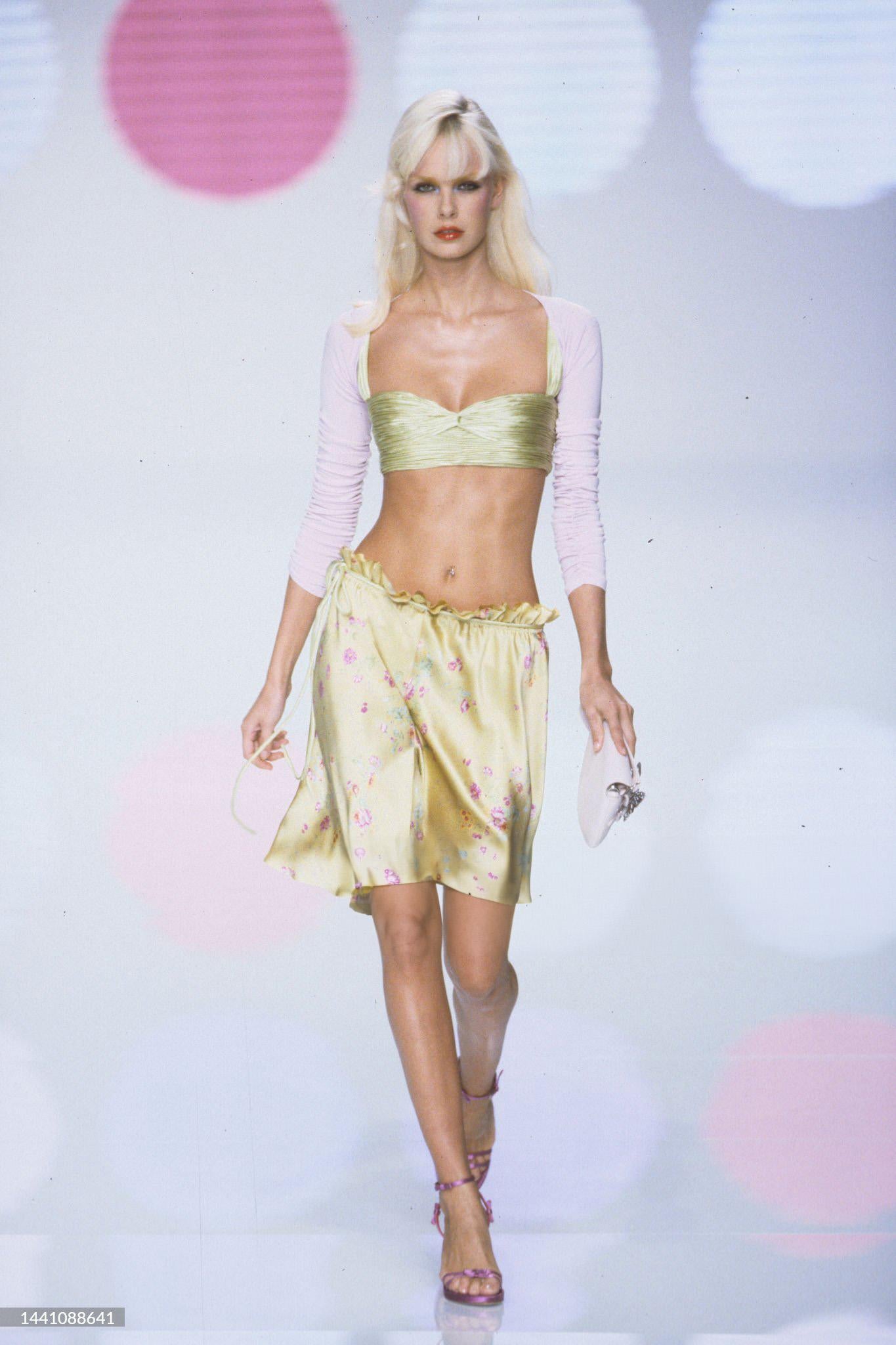 - Designed by Valentino Garavani
- Sold by Skof.Archive
- Spring-Summer 2004
- Pink leather mini bag 
- Butterfly jewel on the frontal pocket 
- Has a front flip pocket and a zipper closure on top
- The interior is a light purple with the red rage