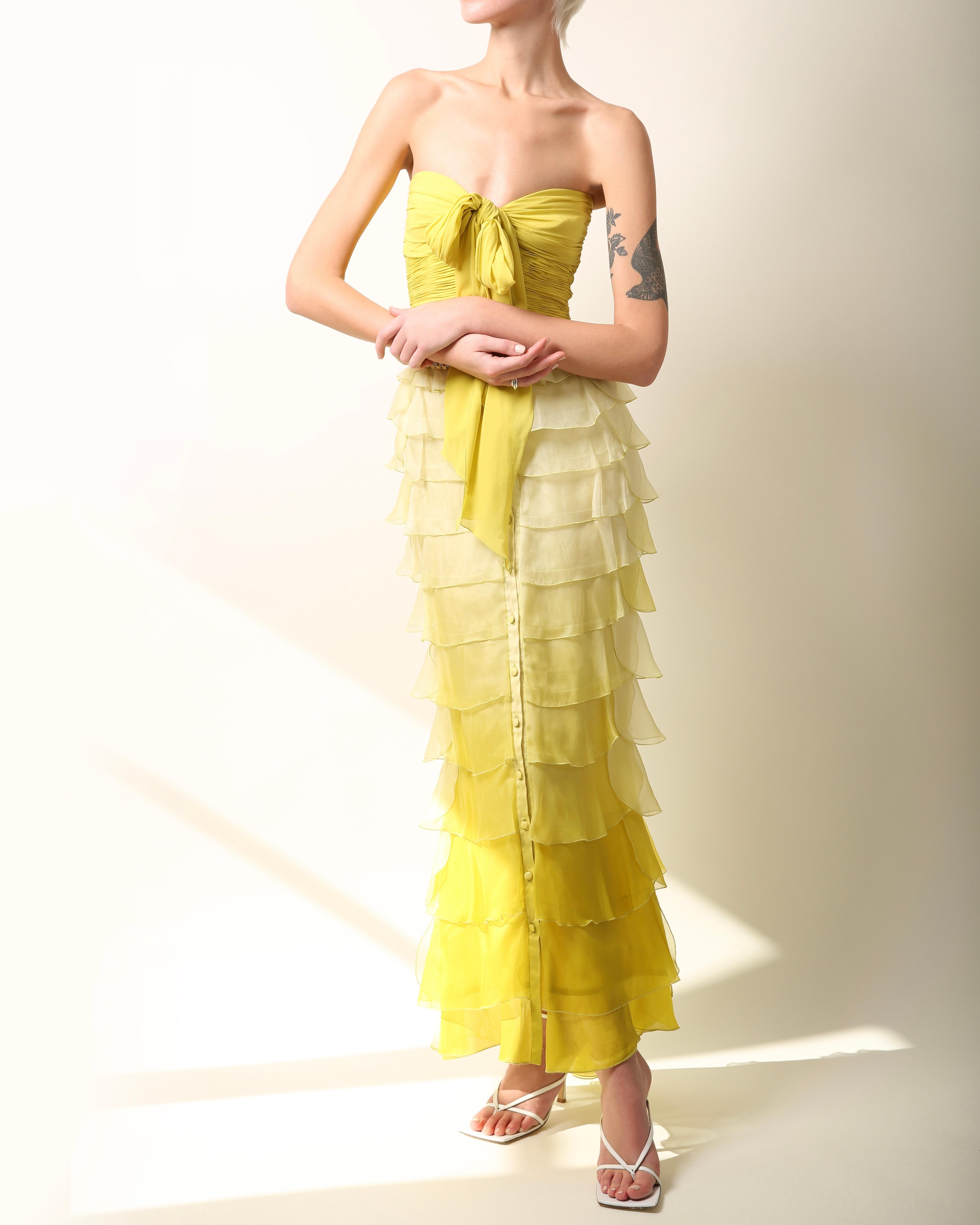 Valentino Spring Summer 2005
Full length strapless gown in chartreuse 
Boned corset upper
Tiered ruffles in sheer ombré silk
Long silk ties at the bust
The dress closes via buttons that run the full length of the dress 
Concealed hooks add extra