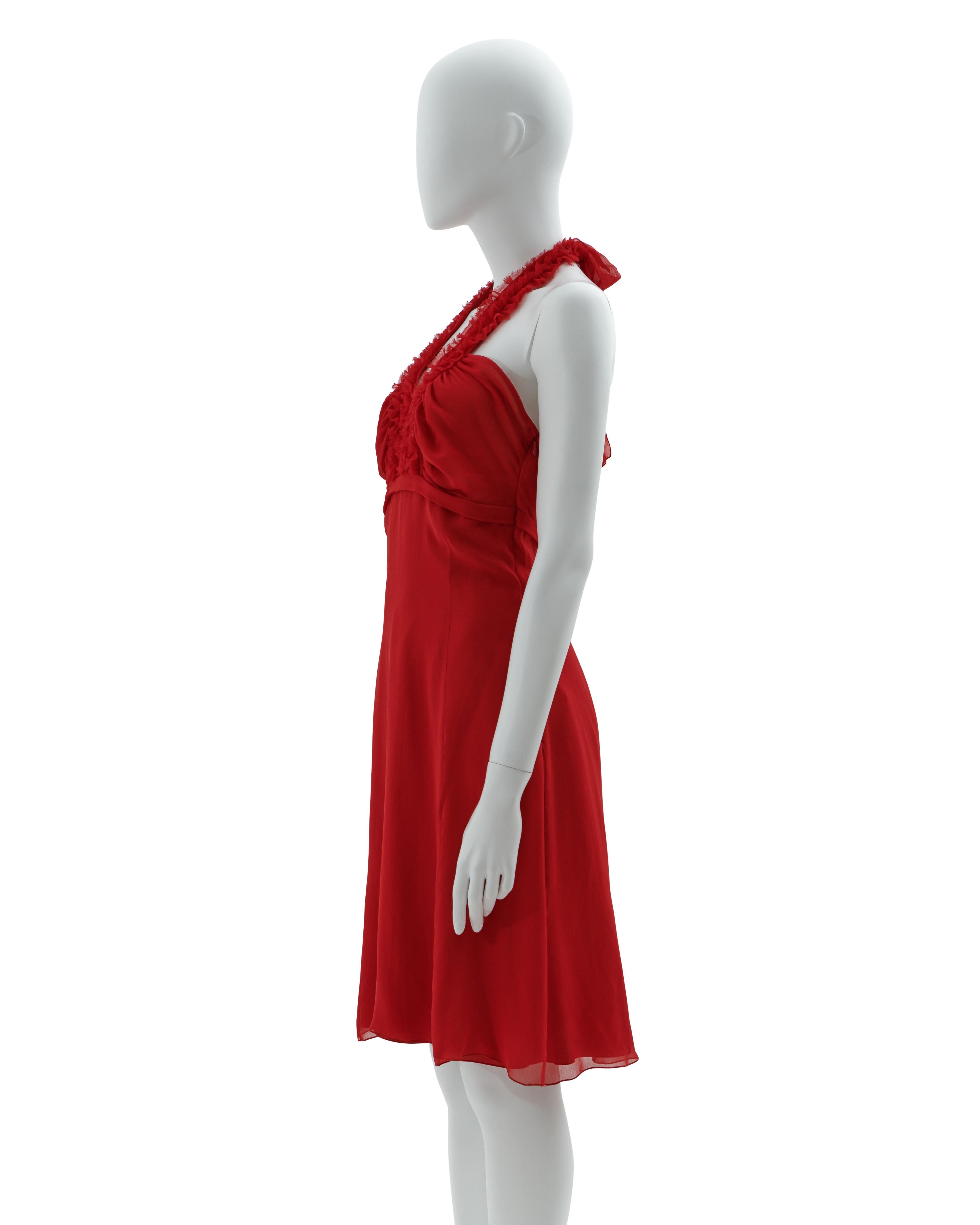 - Red halter neck chiffon cocktail dress
- Sold by Skof.Archive
- Frontal ruffled detail 
- Adjustable American neckline 
- Hidden side zipper closure 
- Spring-Summer 2007
- Made in Italy

Condition: Excellent. Wear consistent with age and use.