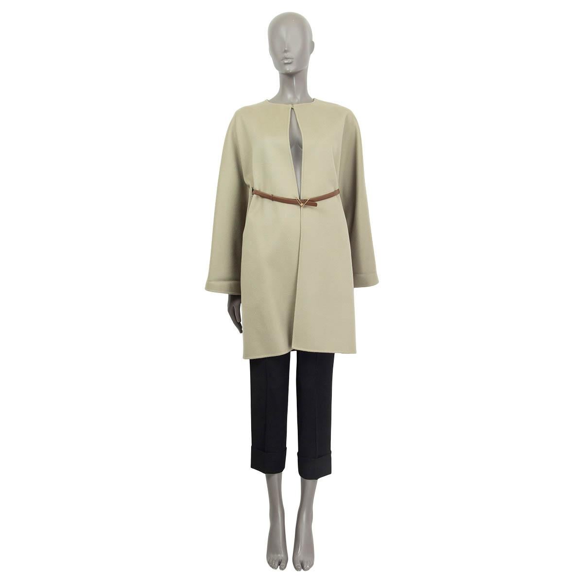 100% authentic Valentino between seasons coat in pale sage green virgin wool (95%) and cashmere (5%). Features a a brown 'V' belt in cowhide (100%) and two side slit pockets. Opens with one hook at the round neck. Pockets lined in pale sage green