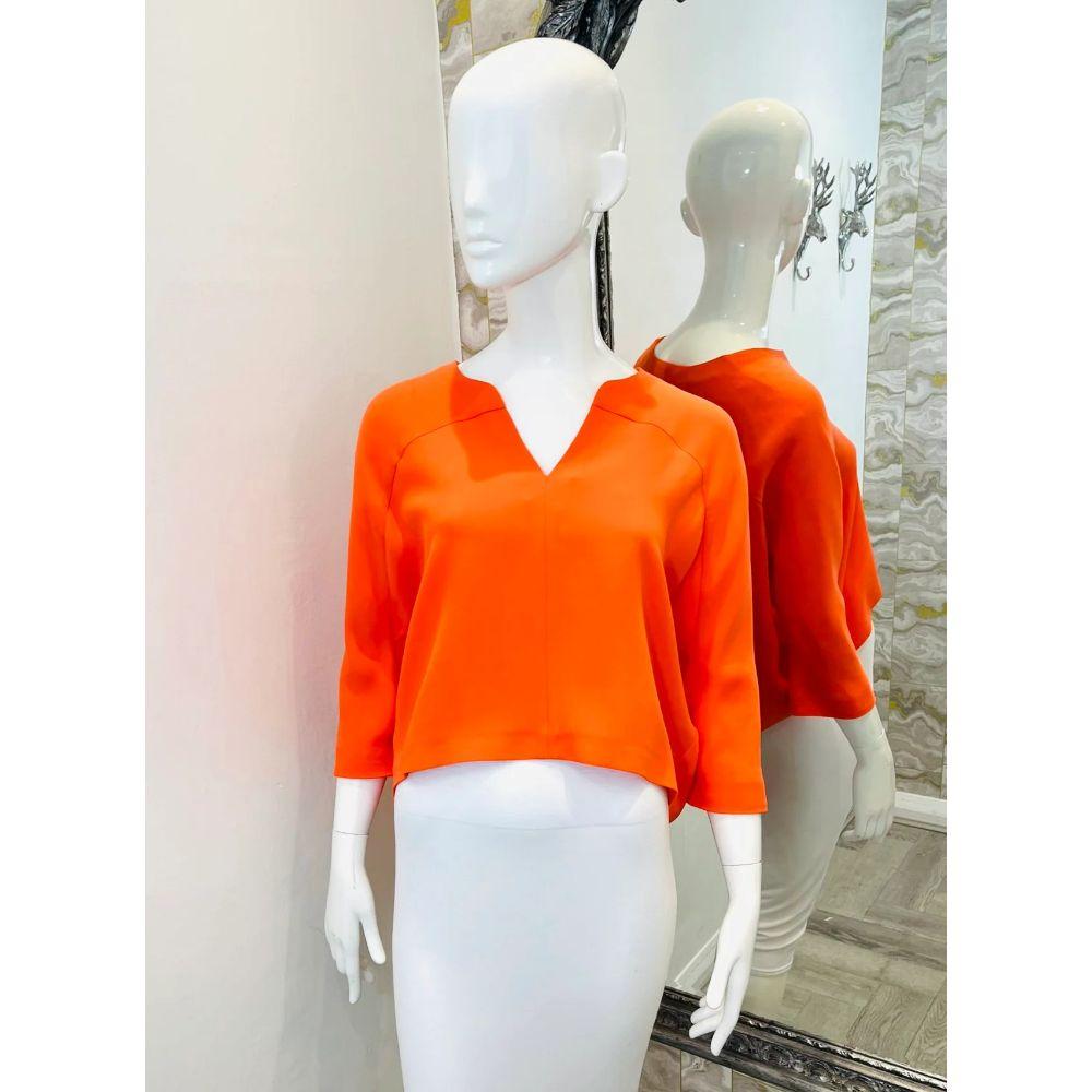 Valentino Silk Blouse

Current season, Orange, high-low top designed in a loose fit silhouette.
Detailed with a V-neckline and three-quarter sleeves. 

Additional information:
Size: 36IT
Composition: 100% Silk
Condition: Brand New, With Labels