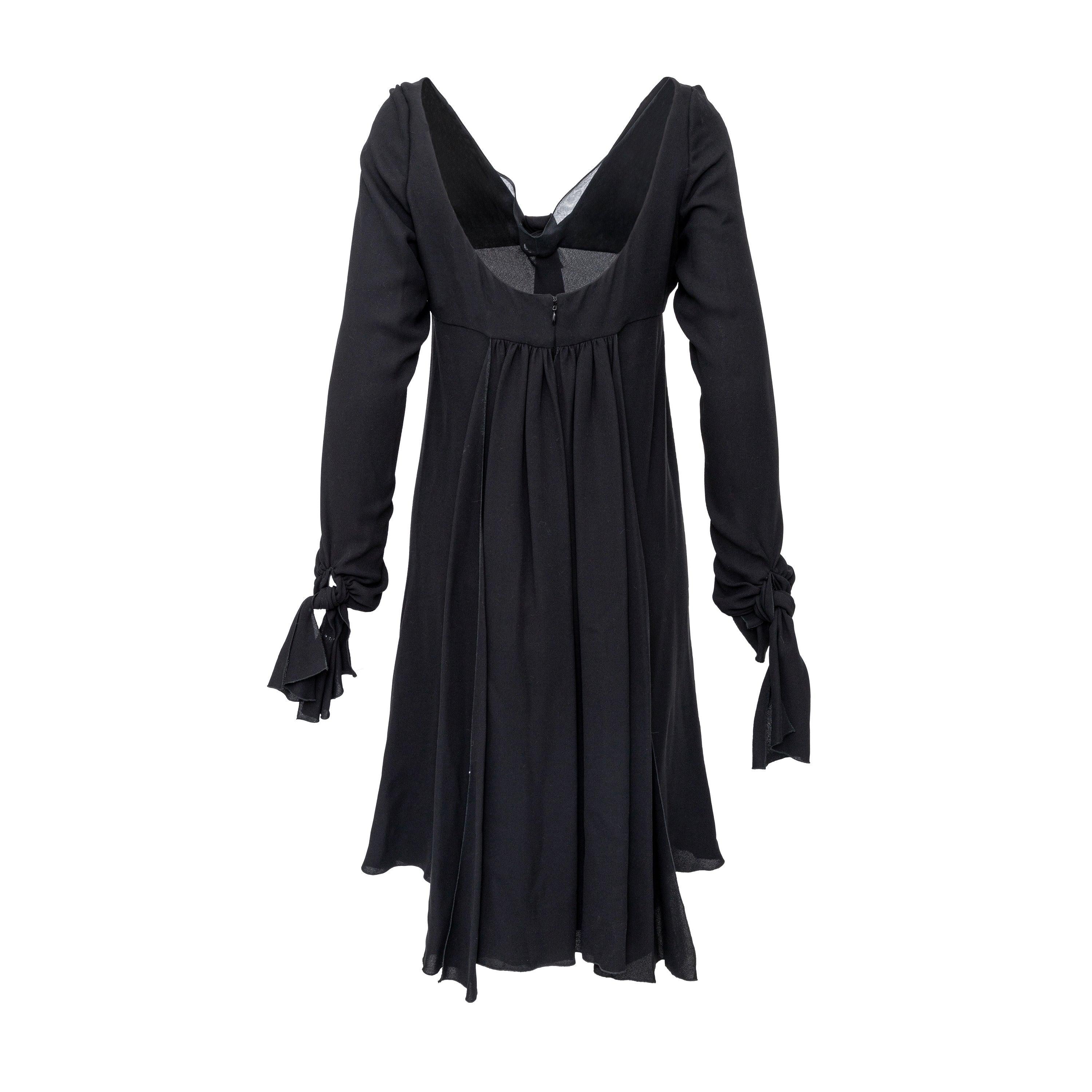 Crafted from soft chiffon silk in black, this vintage dress features a flowy midi silhouette, tie-knot neck, and tassel panel details at the sleeve hems for added elegance. 
 Measurement: Shoulder:44;Sleeve:64;Bust:46;Length:102 
 Material: 100% Silk