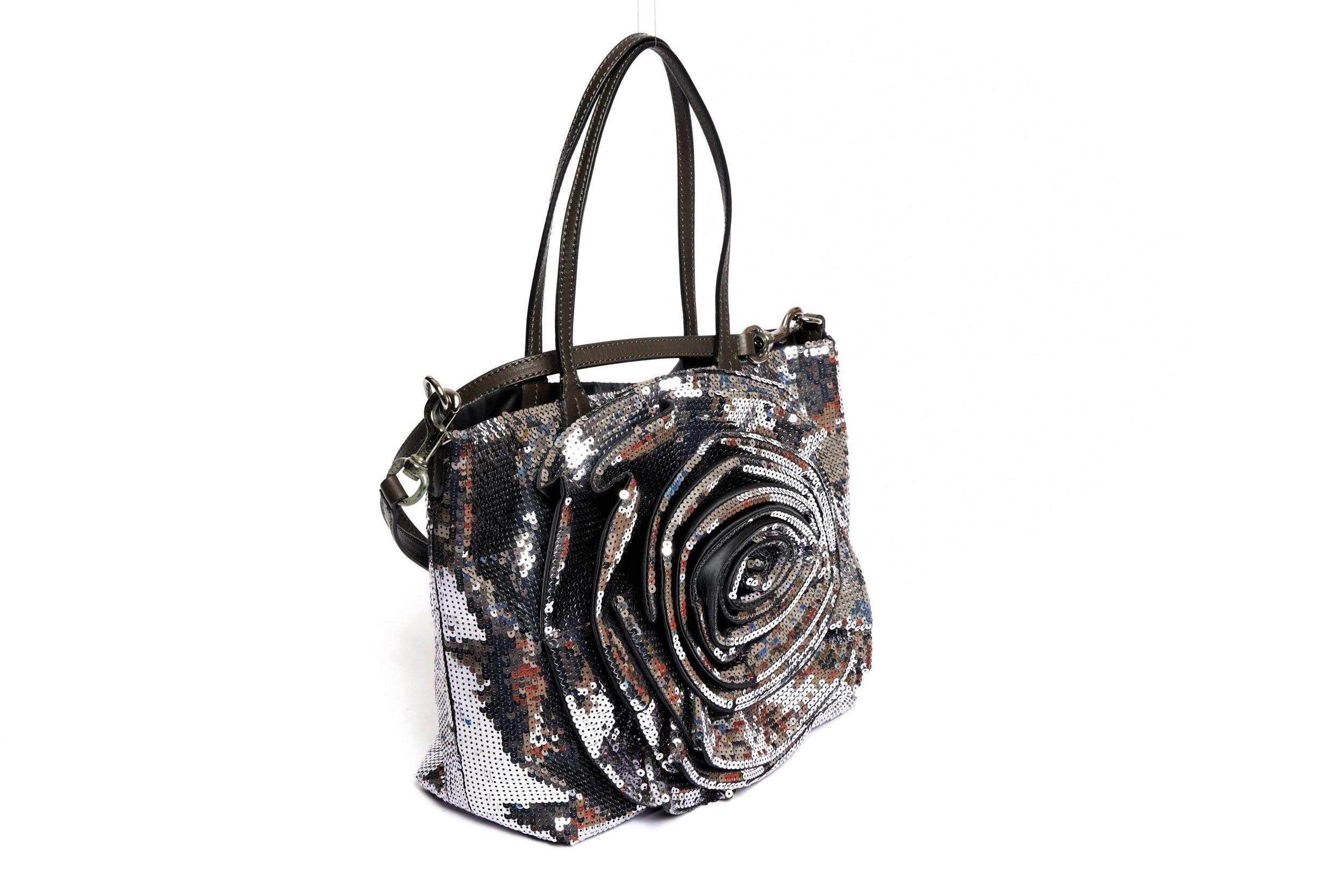 Valentino silver and grey large flower sequins bag in excellent condition. The interior is crafted of a shiny fabric and has one zipped pocket. There are two grey leather handle straps (8
