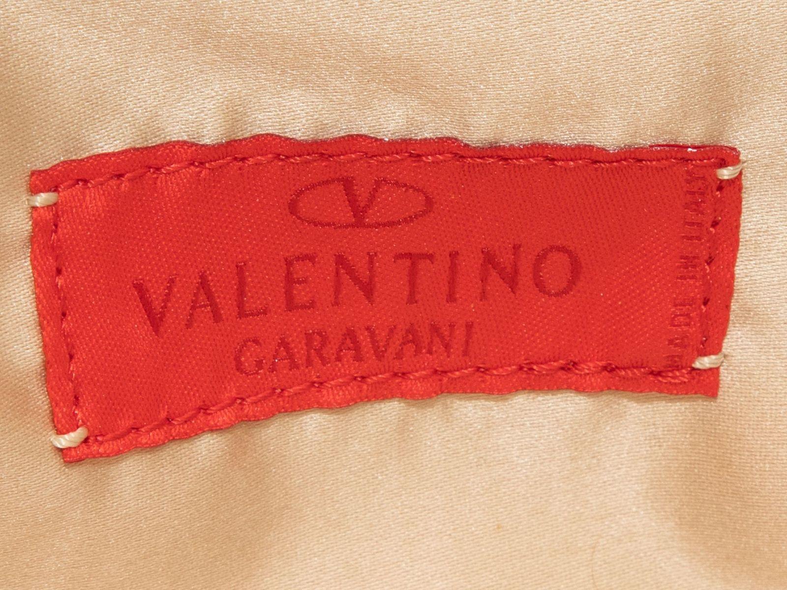 Product Details: Vintage Silver Valentino Rhinestone Handbag. This handbag features a rhinestone body, a single rhinestone top handle, and a top kiss-lock closure. 7
