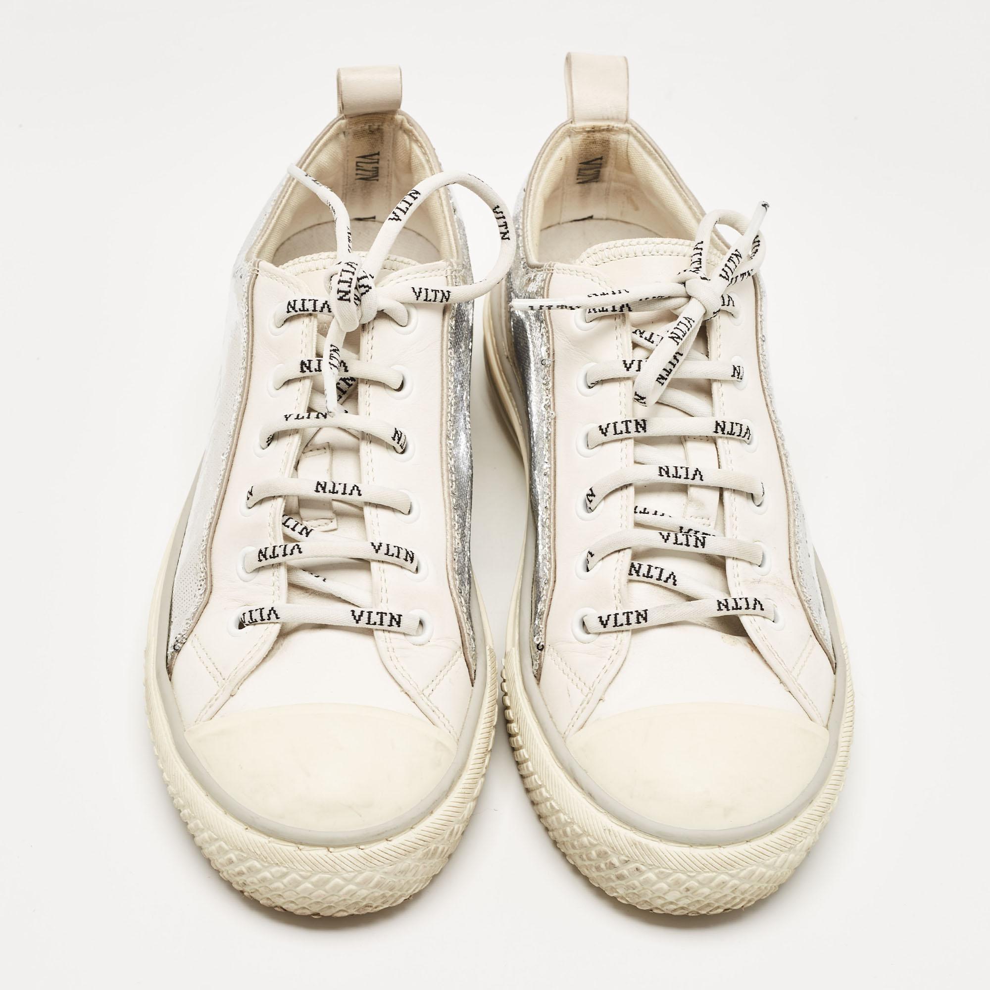 Presented in a classic silhouette, these Valentino sneakers are a seamless combination of luxury, comfort, and style. These sneakers are designed with signature details and comfortable insoles.

Includes
Original Box, Info Booklet