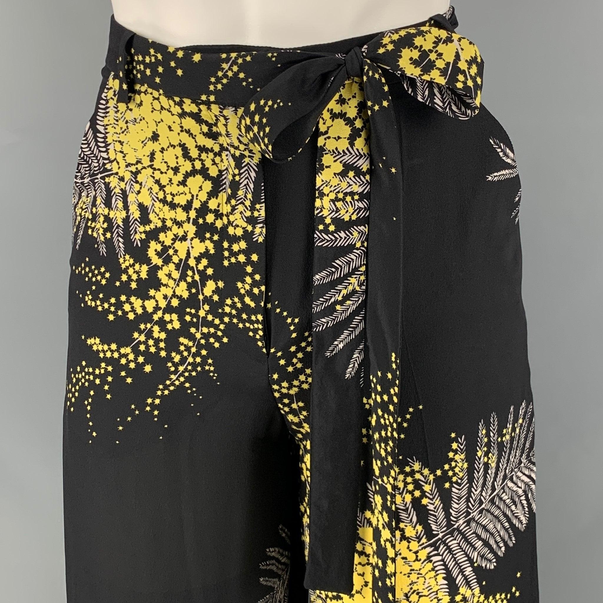 VALENTINO casual pants comes in a black and yellow floral silk featuring a wide leg style, Ti at waistband, high waisted, and a zipper fly closure. Made in Italy.New with Tags. 

Marked:   00 

Measurements: 
  Waist: 25 inches Rise: 12 inches