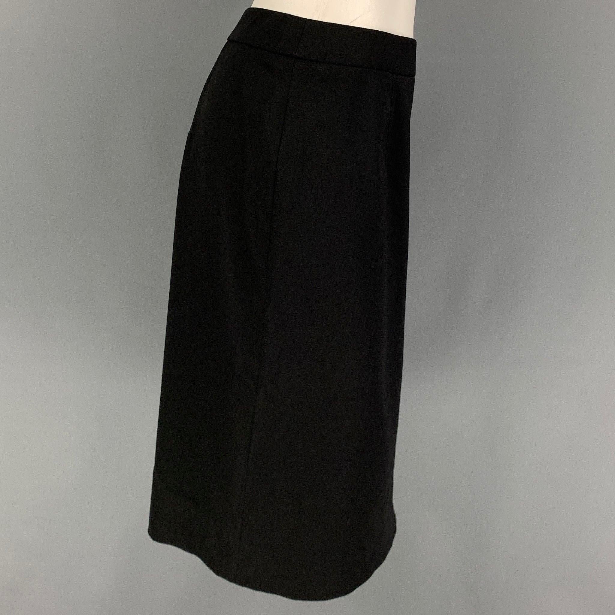 VALENTINO 'HIVER 2008' skirt comes in a black wool featuring a pencil style, back slit, and a side zipper closure. Made in Italy.
 Very Good
 Pre-Owned Condition. 
 

 Marked:  10 
 

 Measurements: 
  Waist: 32 inches Hip: 41 inches Length: 25