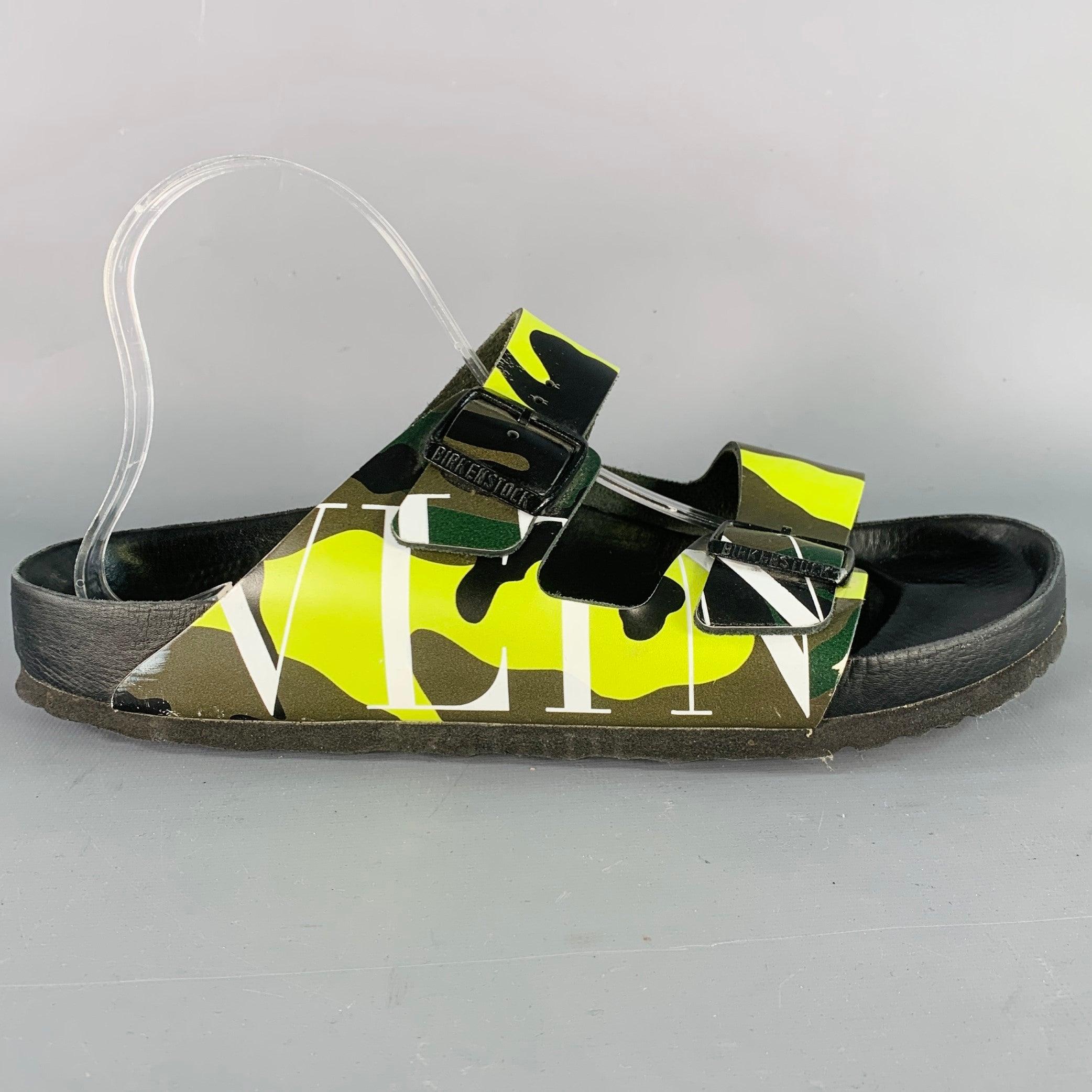 VALENTINO x BIRKENSTOCK sandals
in a green and olive green leather featuring a camouflage pattern with white VLTN logo, double metal buckles, and slip on closure. Made in Germany.Very Good Pre-Owned Condition. Minor creasing. 

Marked:   IT