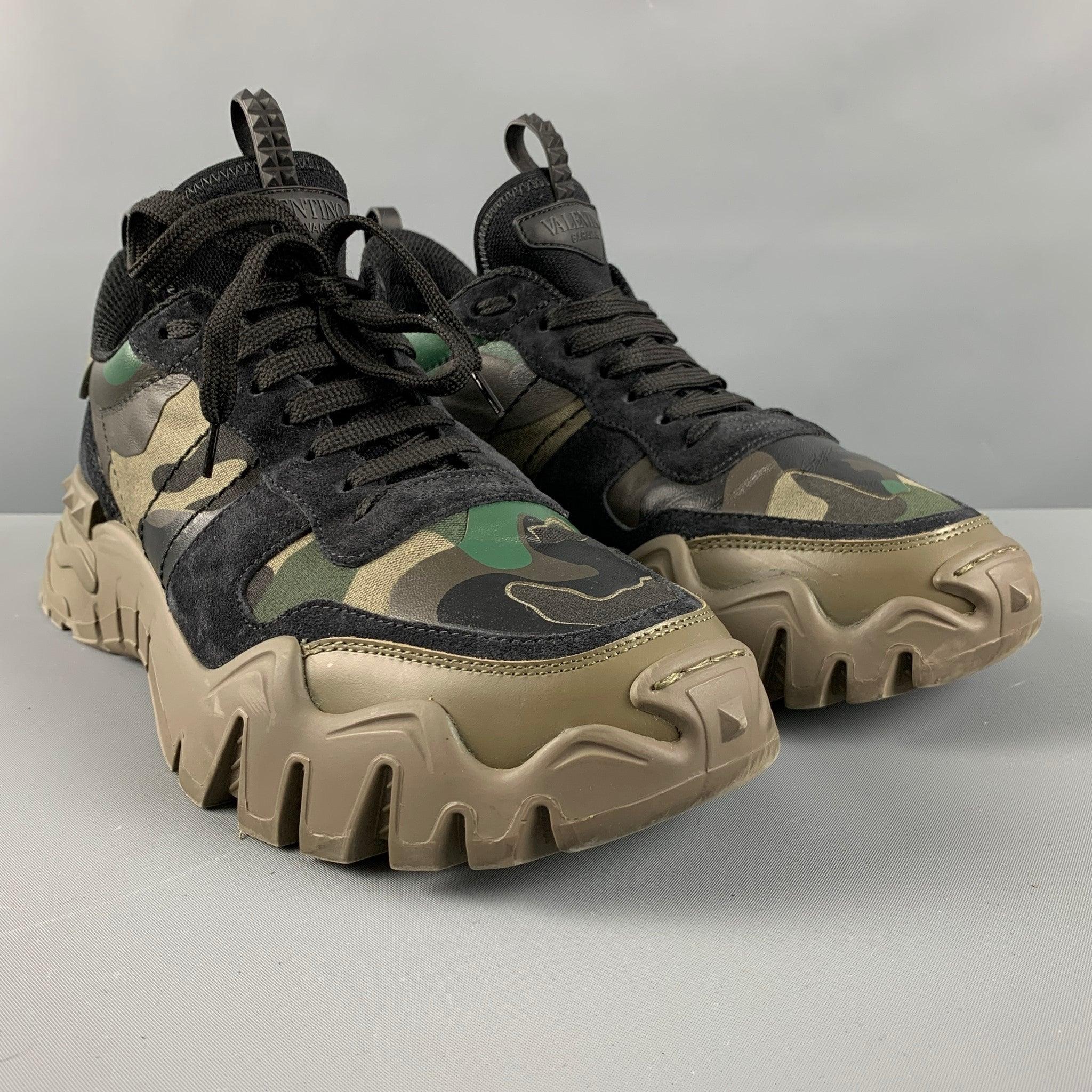 VALENTINO sneakers comes in a black suede featuring a oliver camouflage details, low-top, chunky sole, and a lace up closure. Comes with dust bag and box. Made in Italy.Excellent Pre-Owned Condition. 

Marked:   TTC88Y0 43Outsole: 12.75 inches  x 5