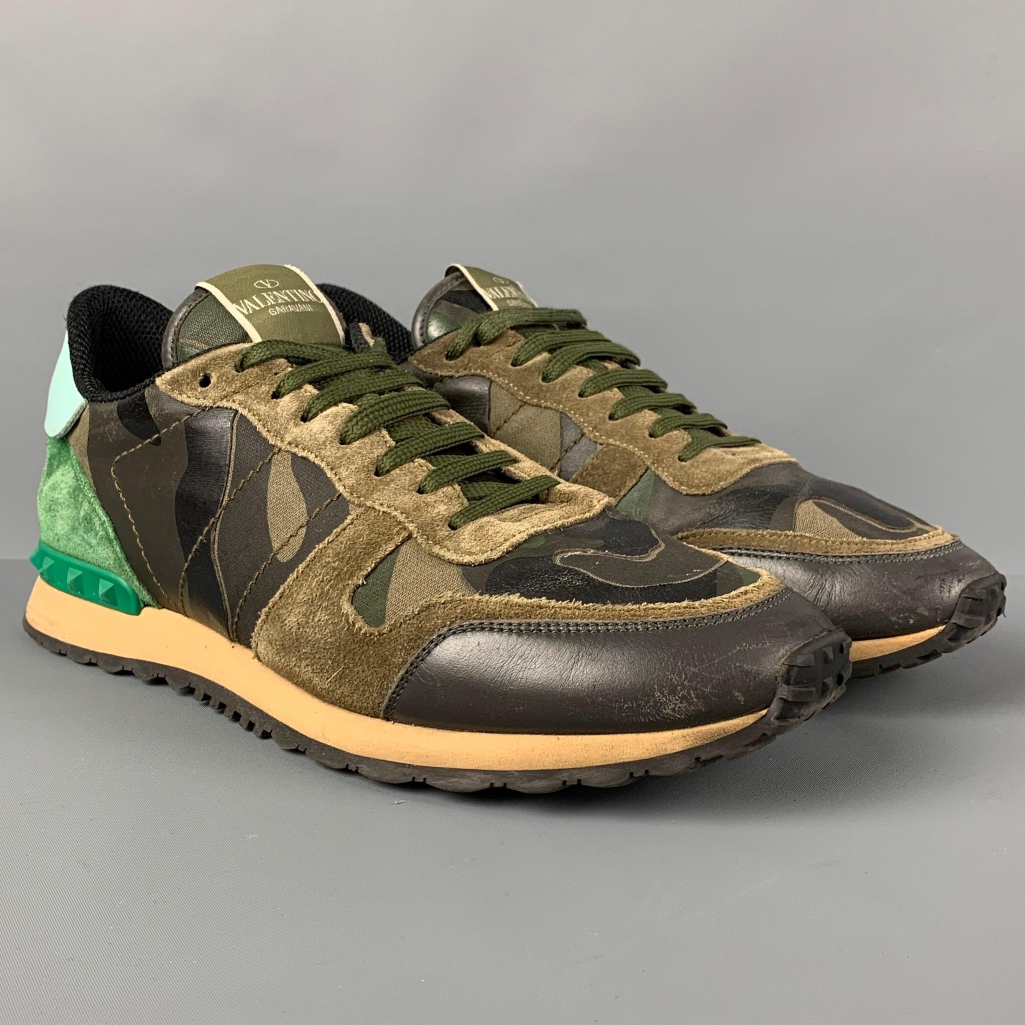 VALENTINO sneakers comes in a olive & brown camo leather featuring a suede trim, rubber stud details, and a lace up closure. Made in Italy. 

Very Good Pre-Owned Condition.
Marked: Size tag removed.

Outsole: 12 in. x 4.25 in.