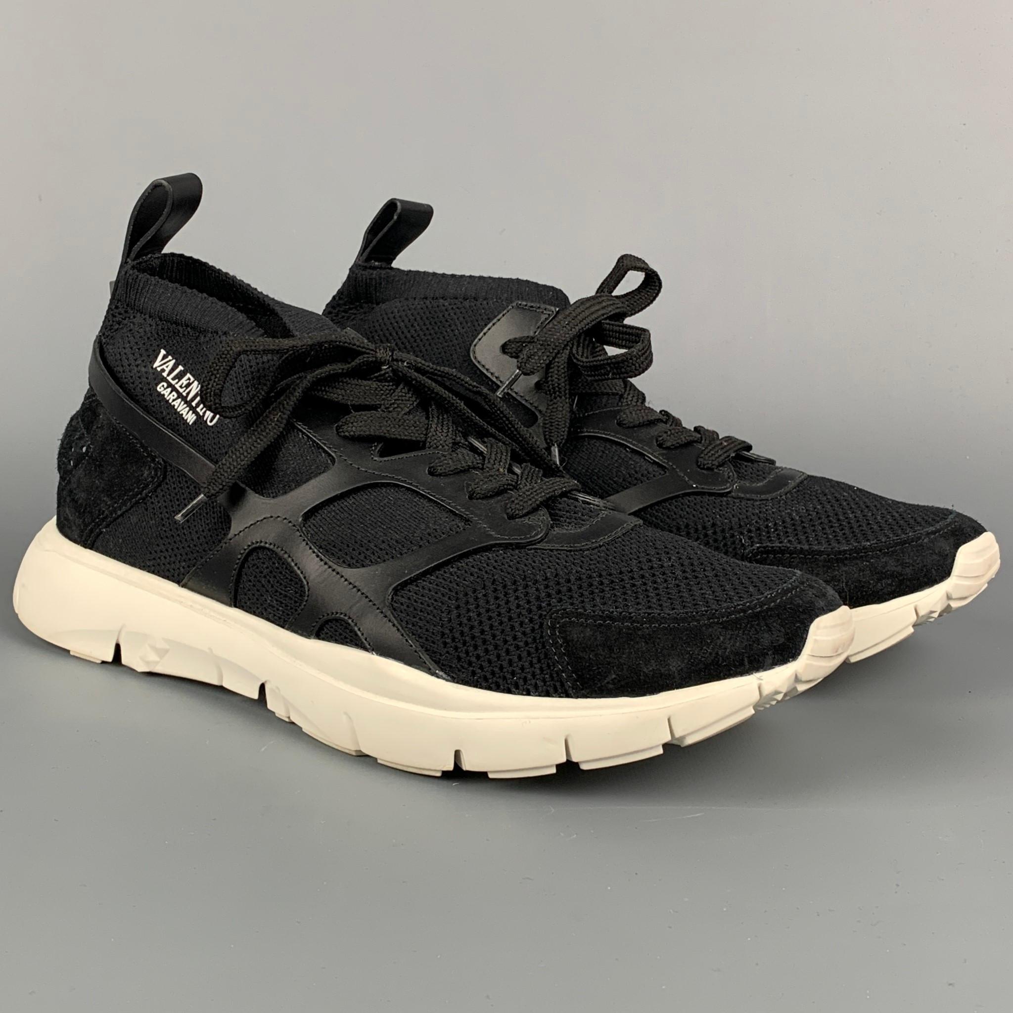 VALENTINO sneakers comes in a black mesh material with leather trim featuring featuring  slip on style, rubber sole, and a lace up closure. Made in Italy. 

Very Good Pre-Owned Condition.
Marked: TPA57Y0 45

Outsole: 13 in. x 4.5 in. 