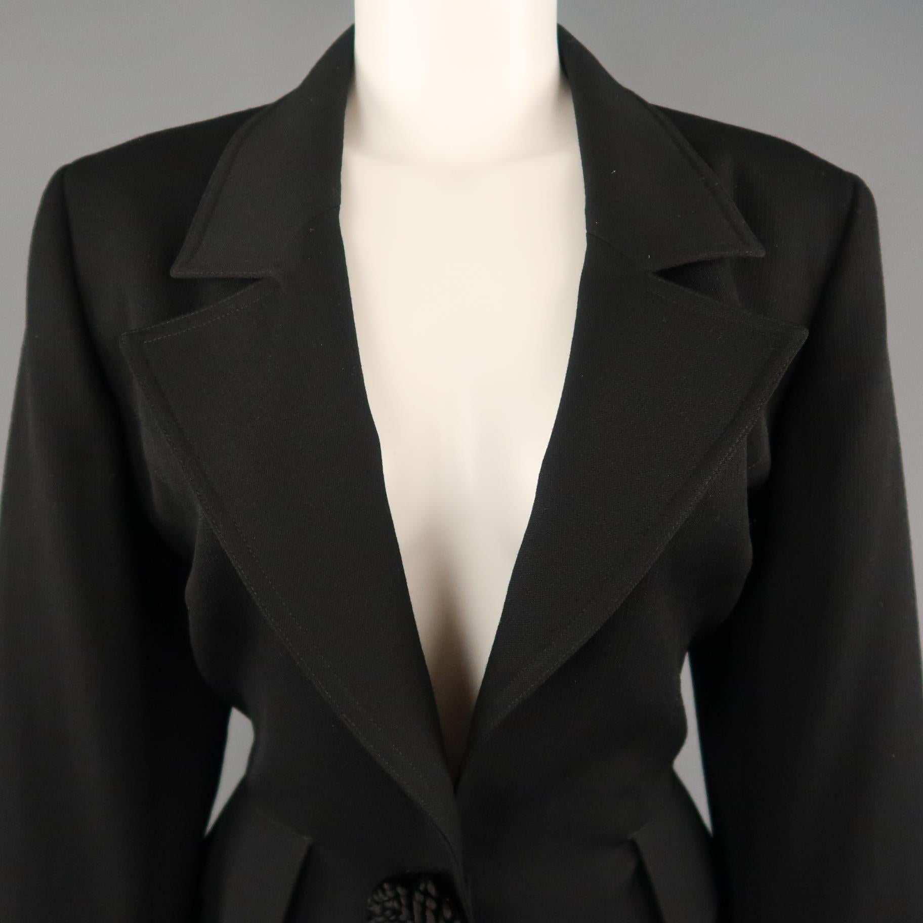 VALENTINO MISS V cropped sport jacket comes in black wool with a pointed lapel, flap pockets, single button closure, an fringe flower appliques. Made in Italy.
 
Excellent Pre-Owned Condition.
Marked: 12
 
Measurements:
 
Shoulder: 17 in.
Bust: 42