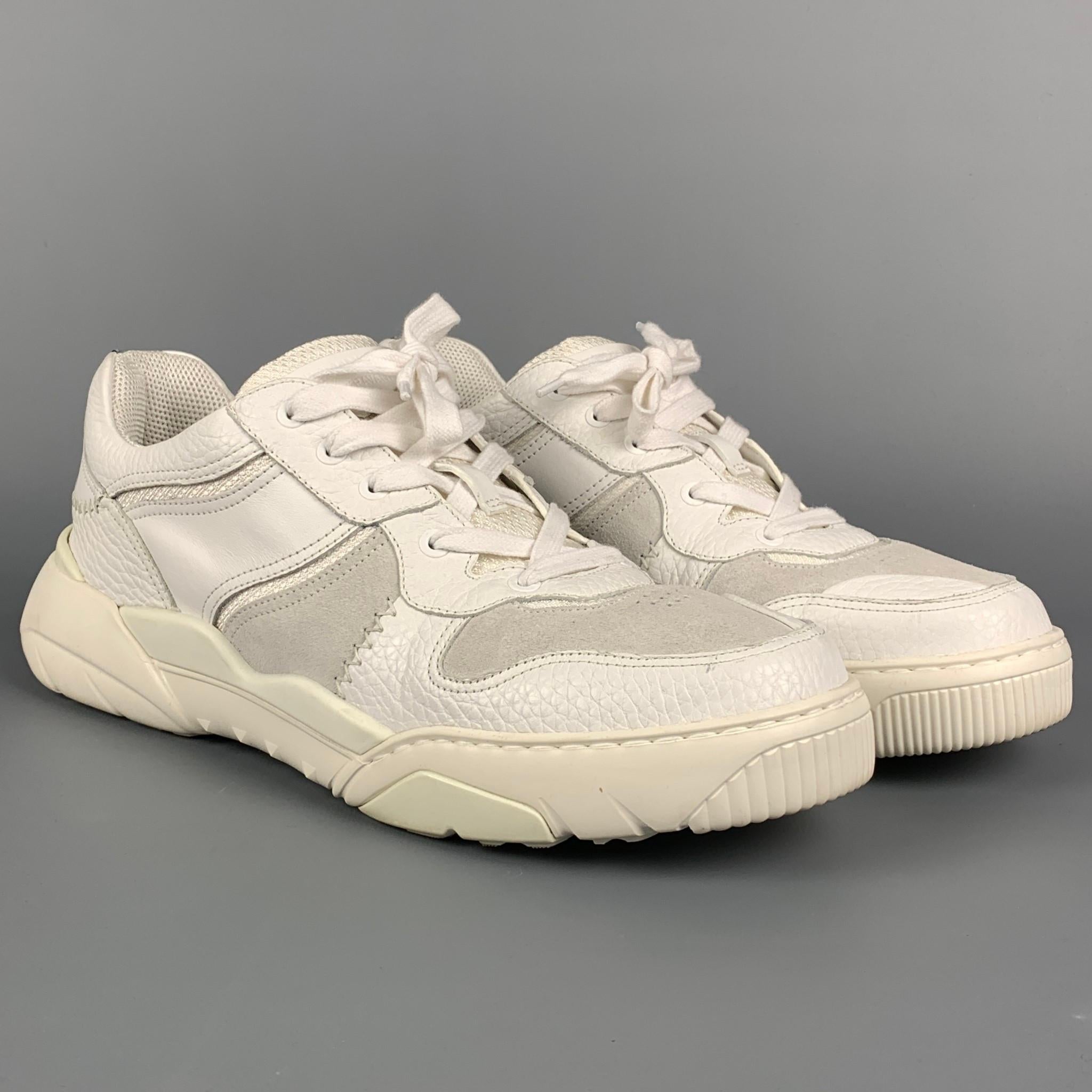 VALENTINO sneakers comes in a white & light grey leather featuring a chunky rubber sole, top stitching, and a lace up closure. Made in Italy. 

Very Good Pre-Owned Condition.
Marked: TRB78Y2 45

Outsole: 13 in. x 4.5 in. 