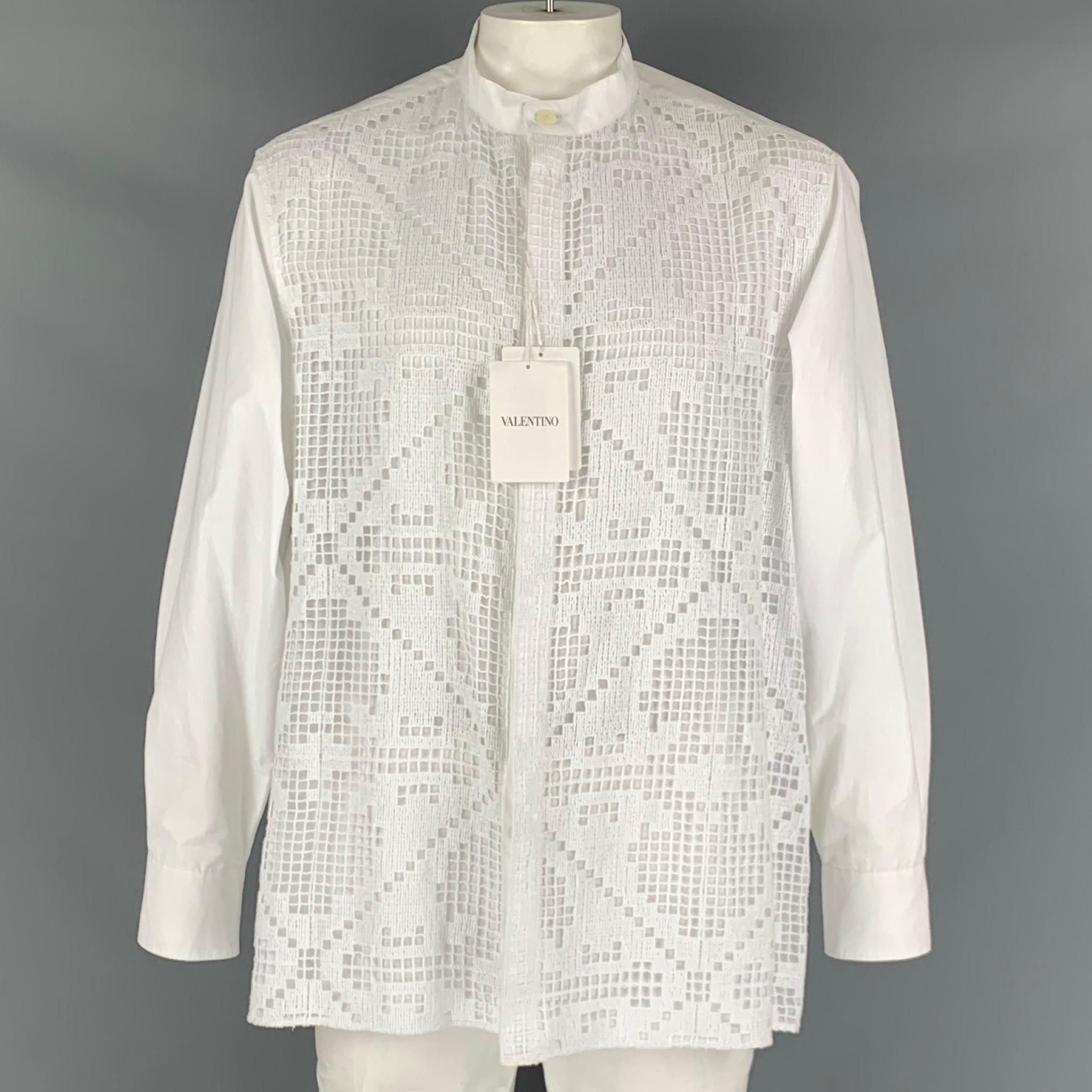 VALENTINO long sleeve shirt comes in a white cotton material, with a white guipure front panel featuring a collarless style, hidden placket, and buttons up closure. Made in Italy.

New With Tags
Marked: 44- 17 1/5

Measurements:

Shoulder: 19.5